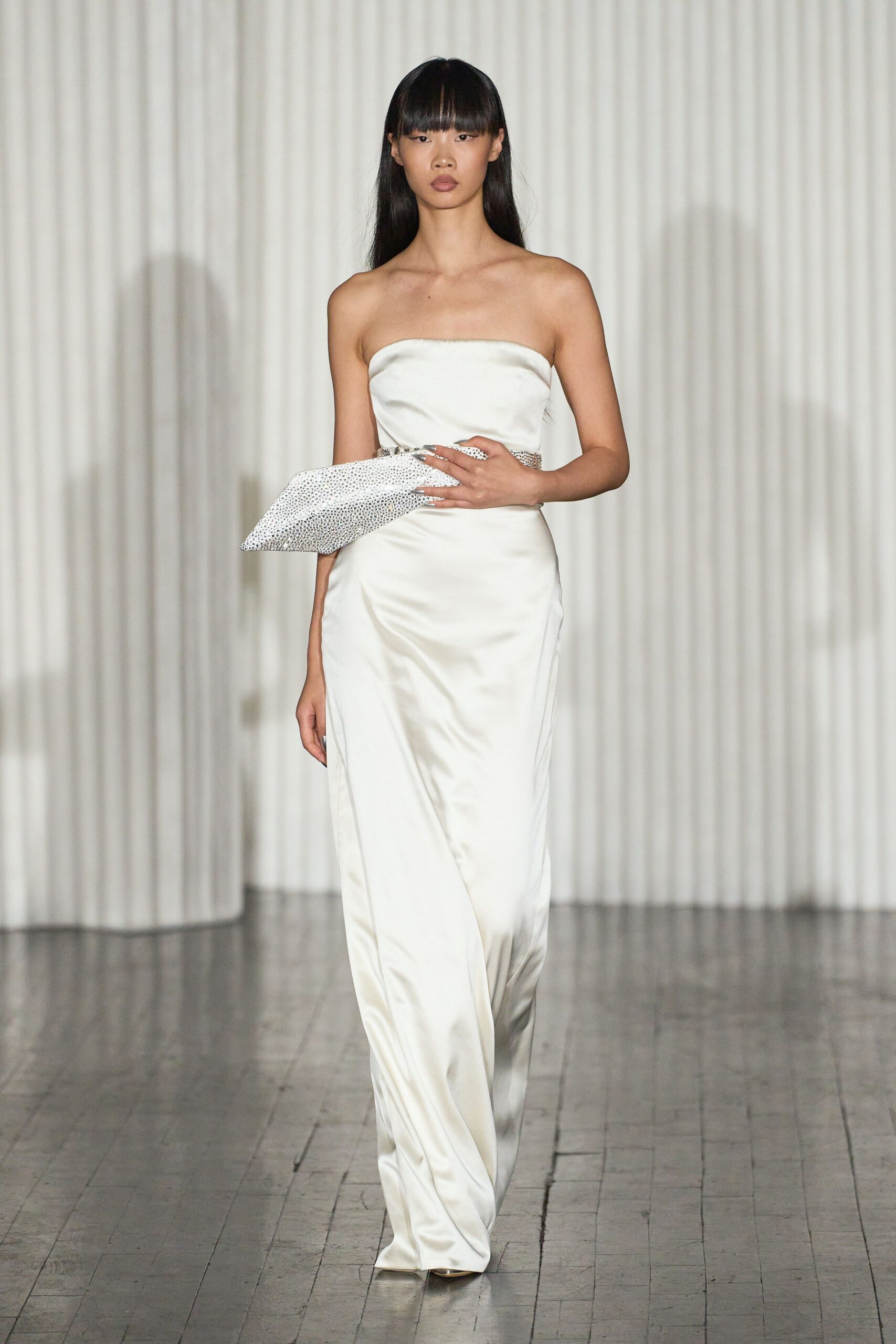 white silk strapless fitted draped flowing maxi gown