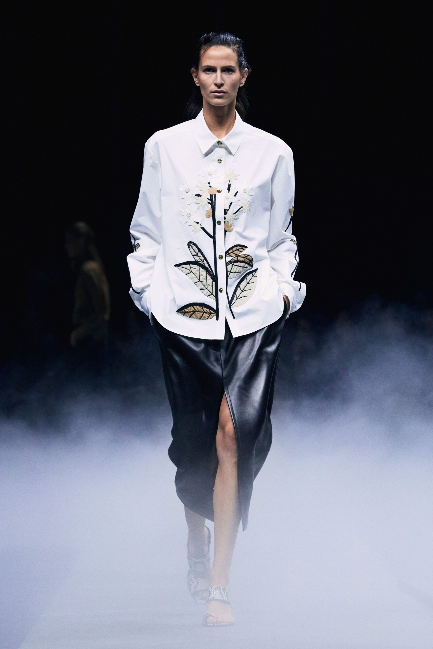 white embroidered shirt black leather skirt
