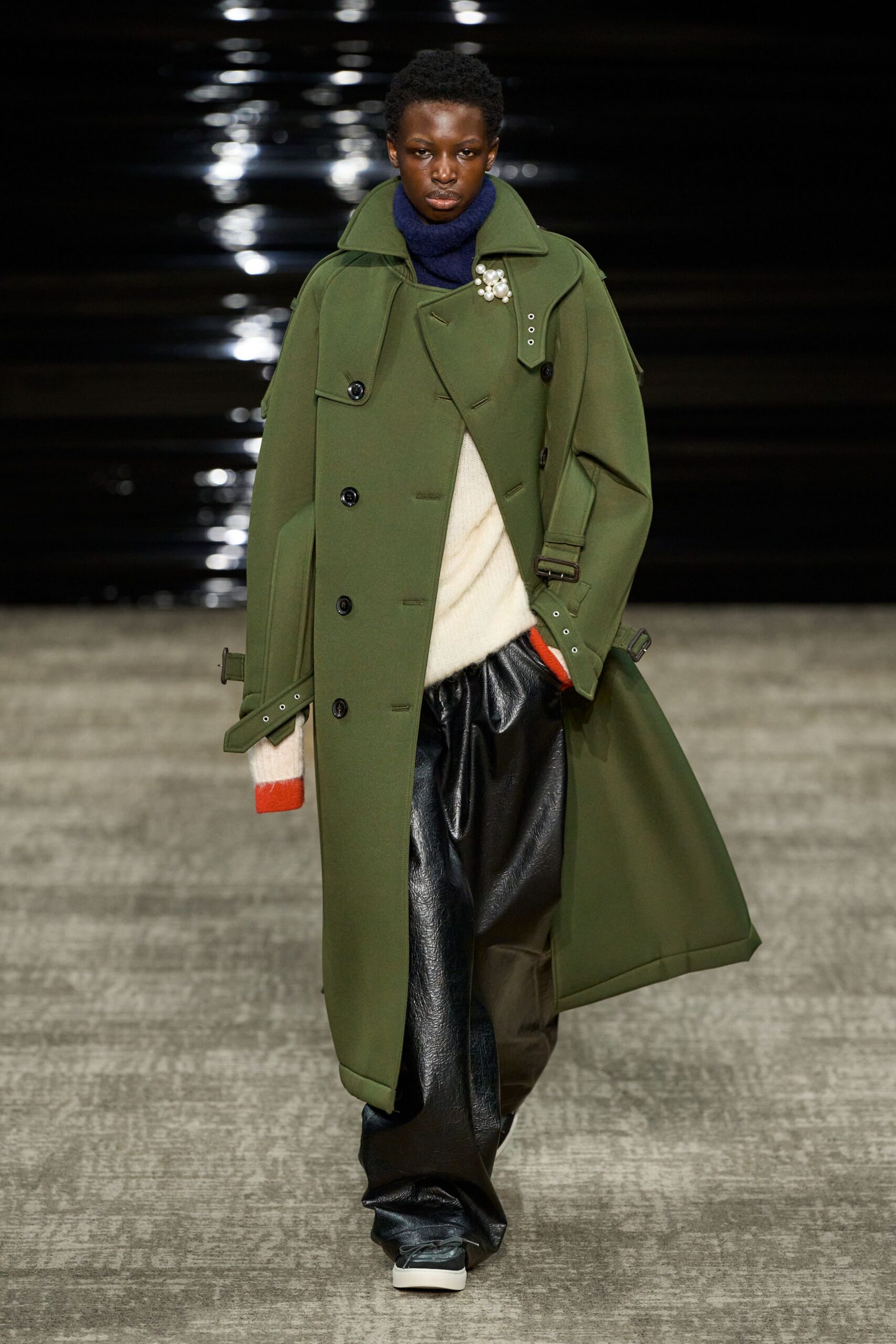 green oversized coat with black pants