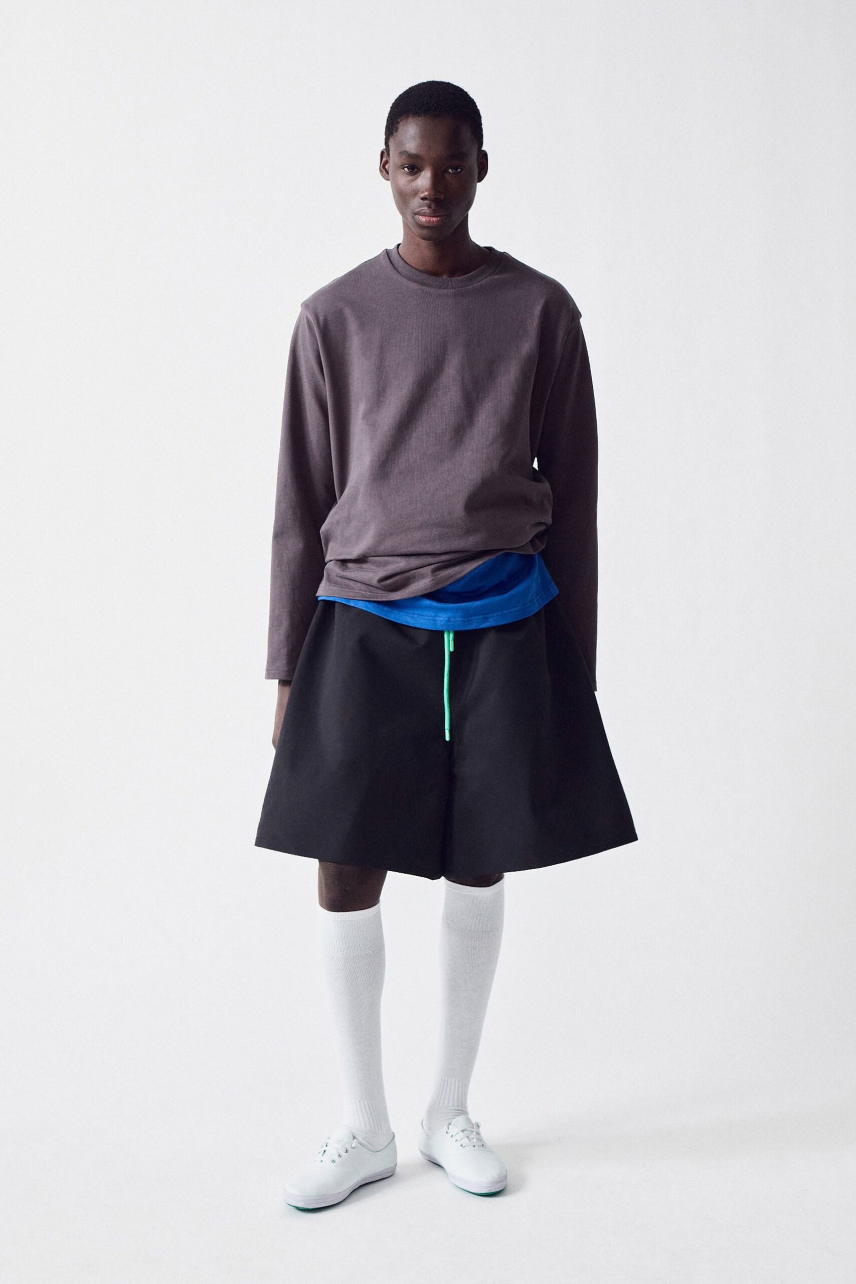 gray relaxed top with black skirt