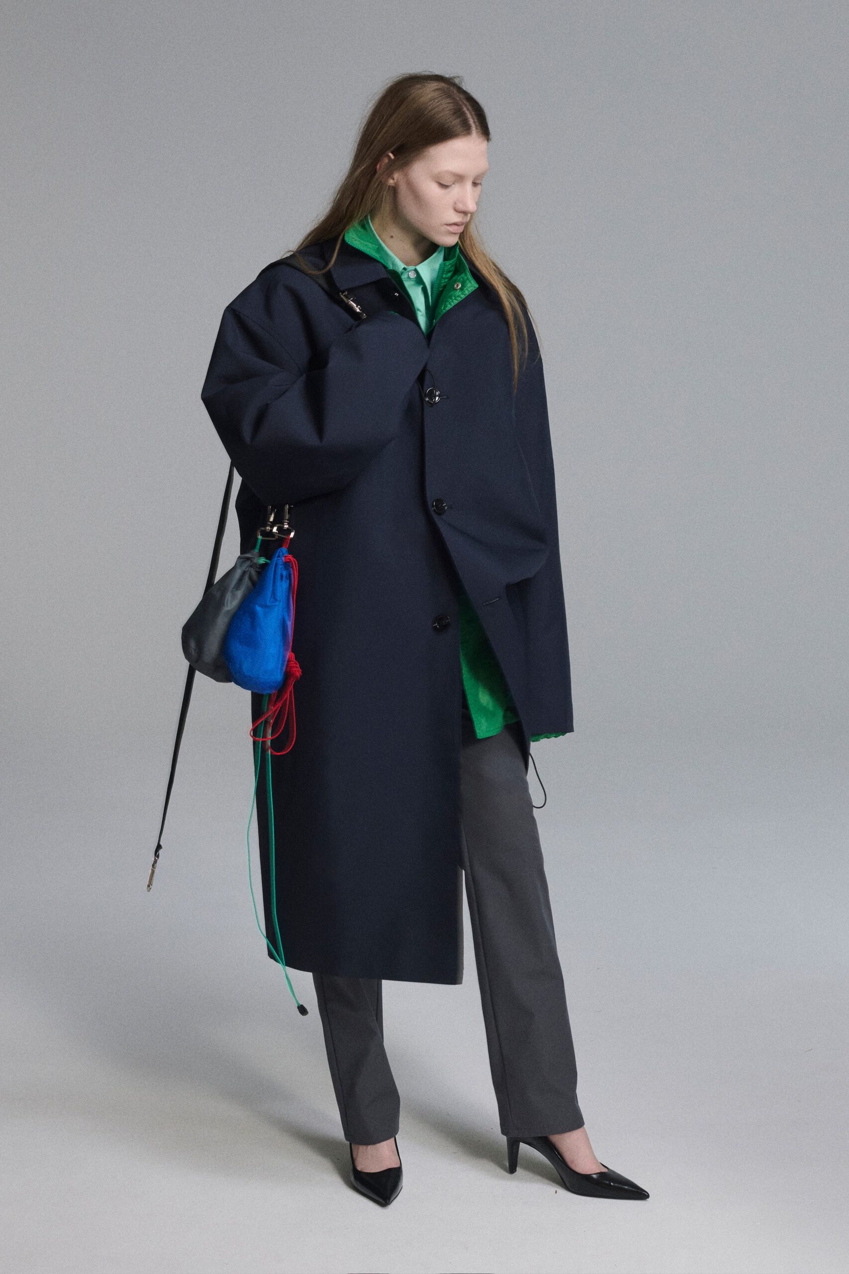 oversized black coat with green shirt