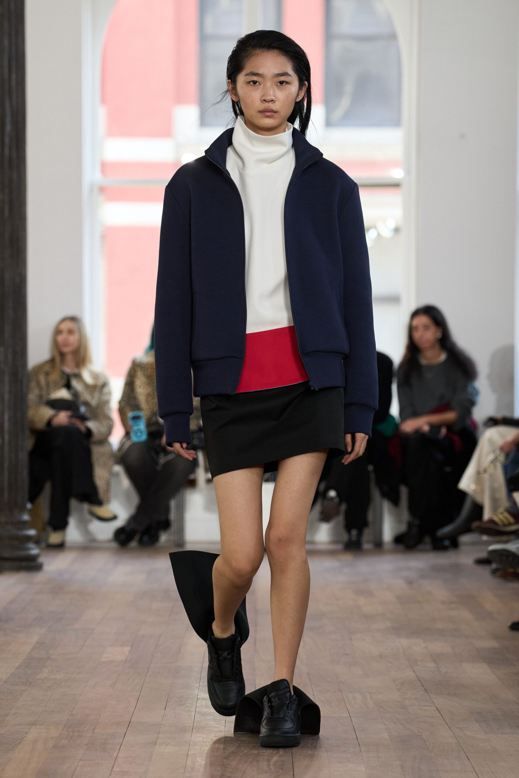 navy jacket with fitted top and skirt