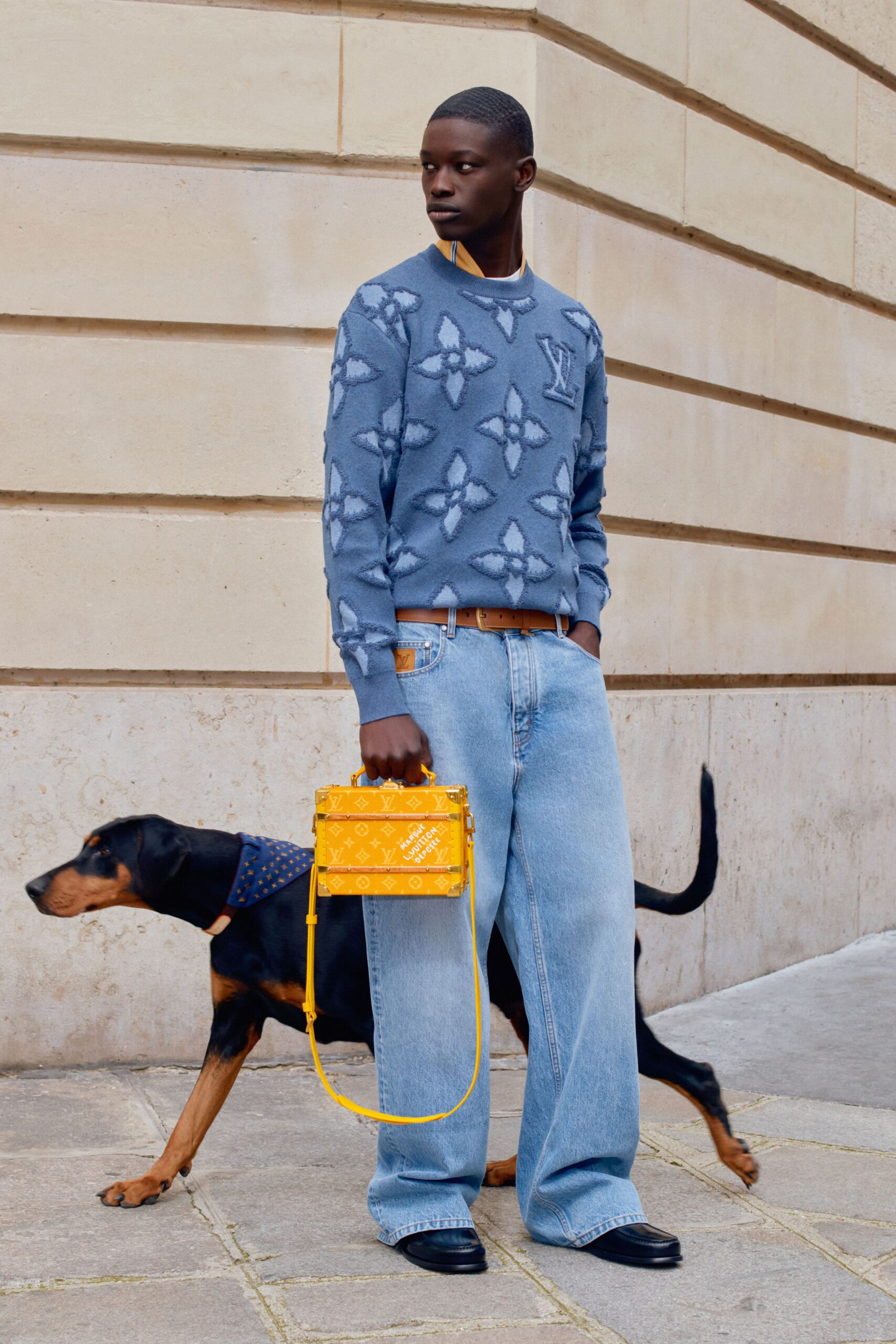 blue relaxed sweater with yellow bag