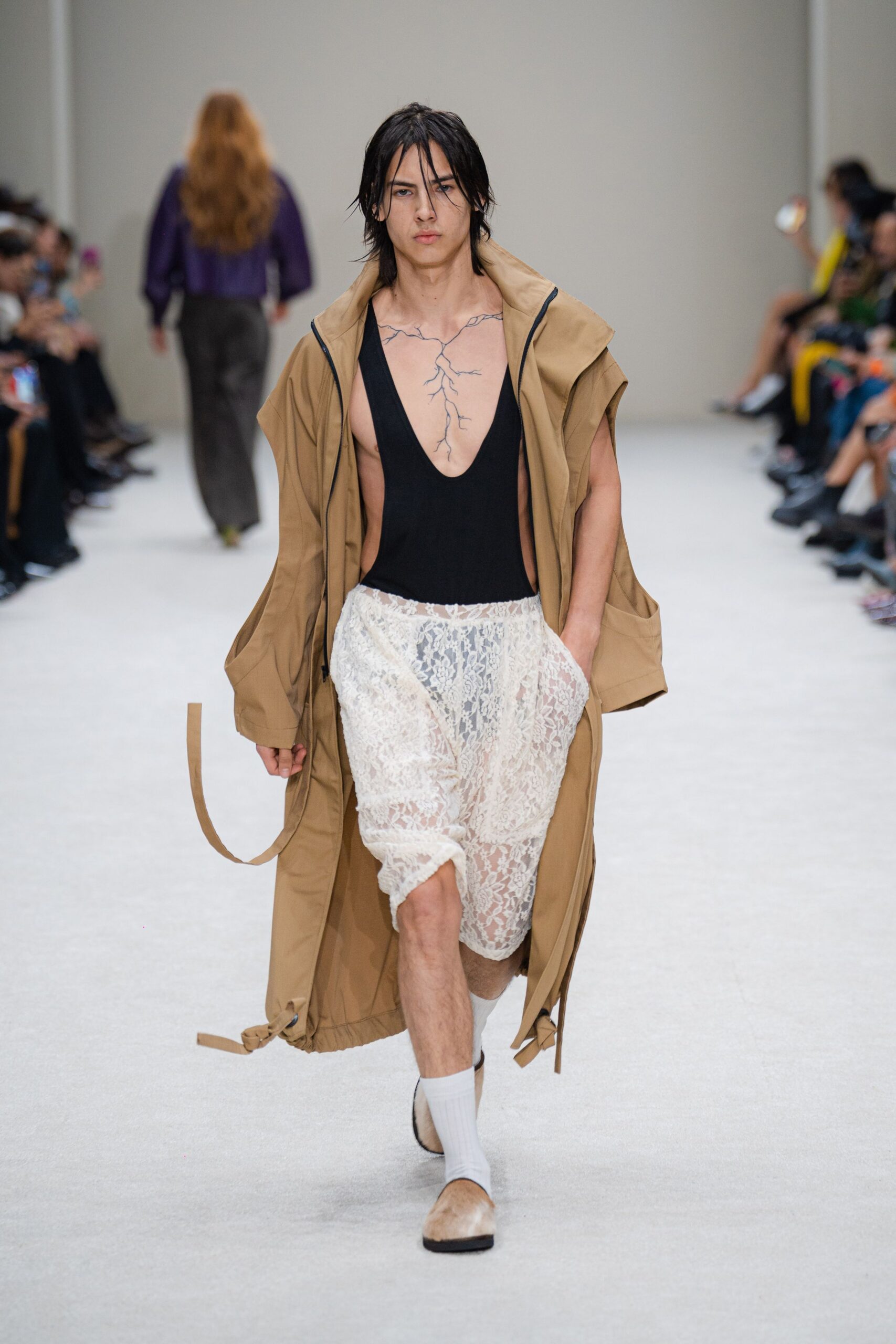 beige coat black bodysuit white lace shorts