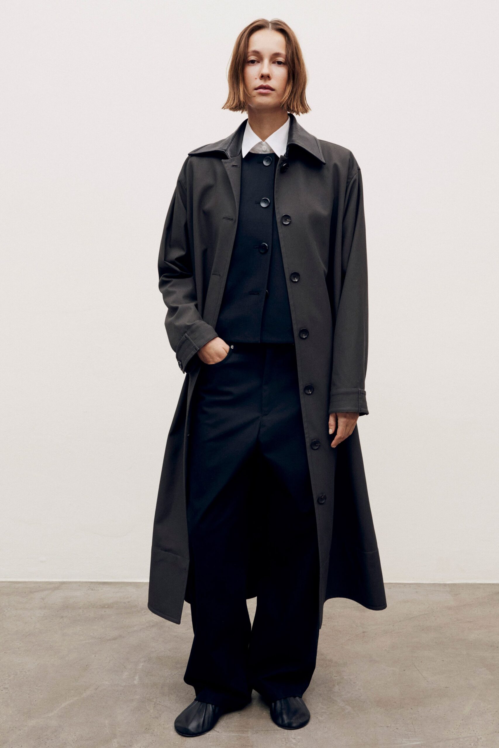 black cotton long-sleeve collared relaxed buttoned maxi coat