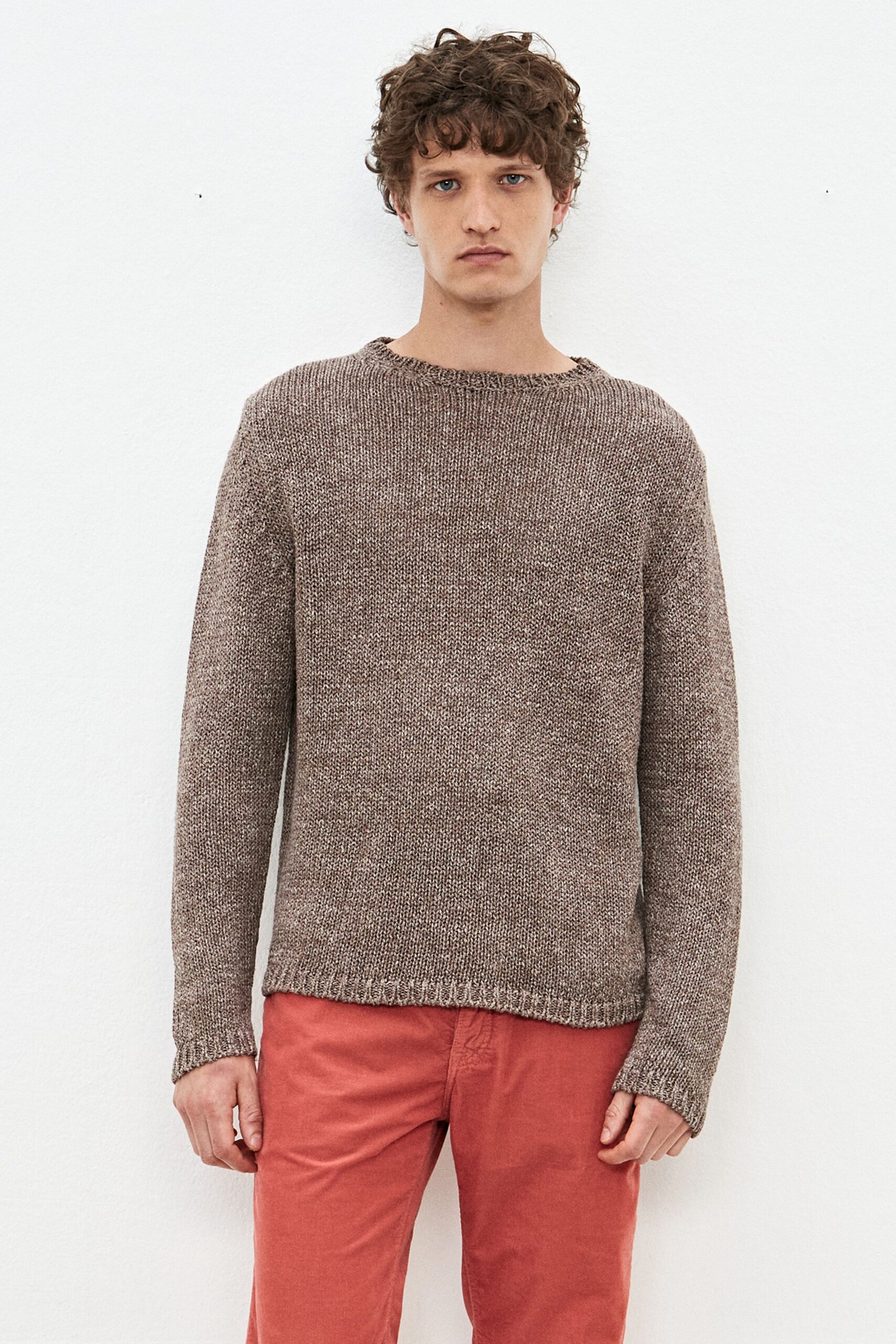 brown relaxed sweater and red pants
