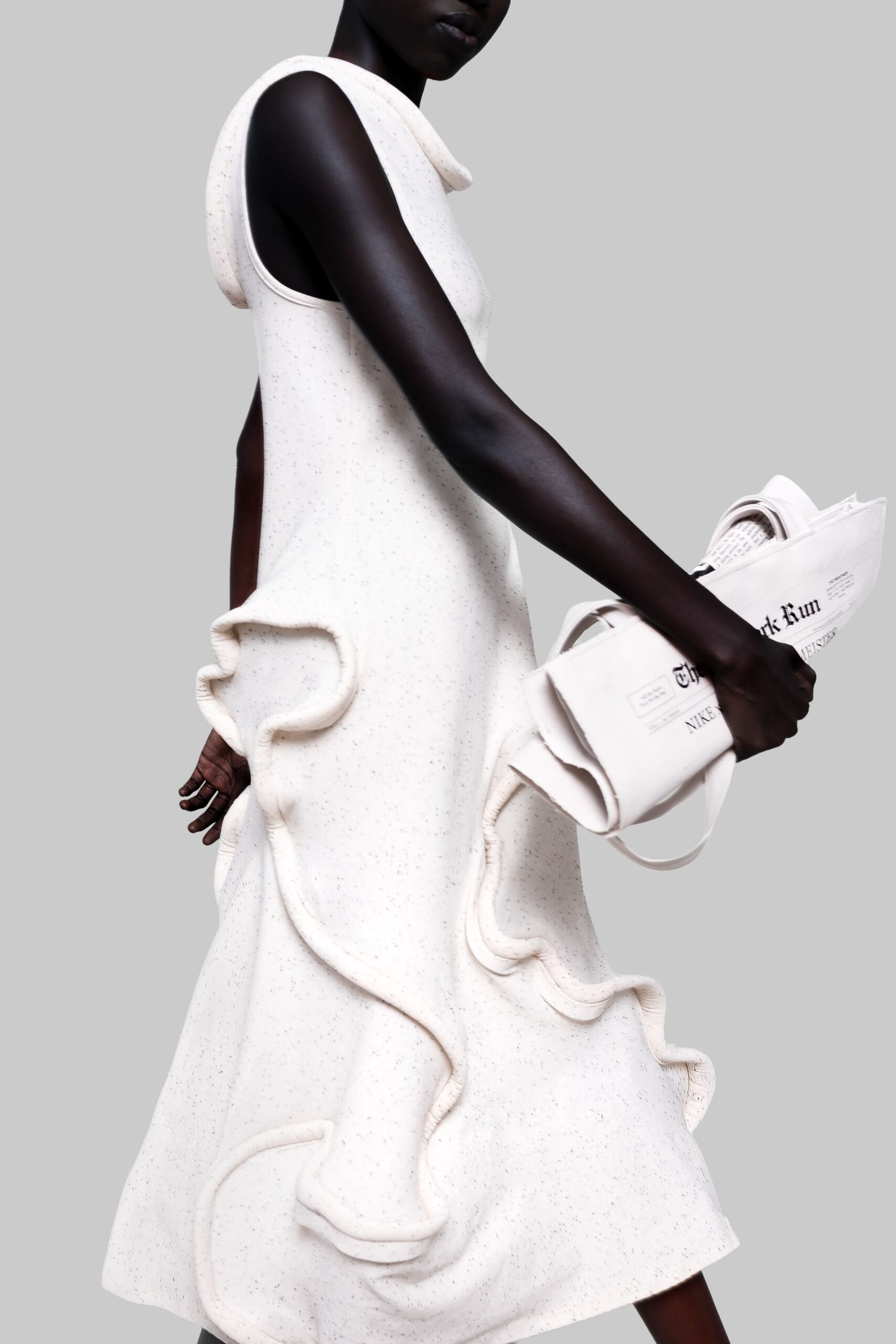 white ruffled midi dress and bag