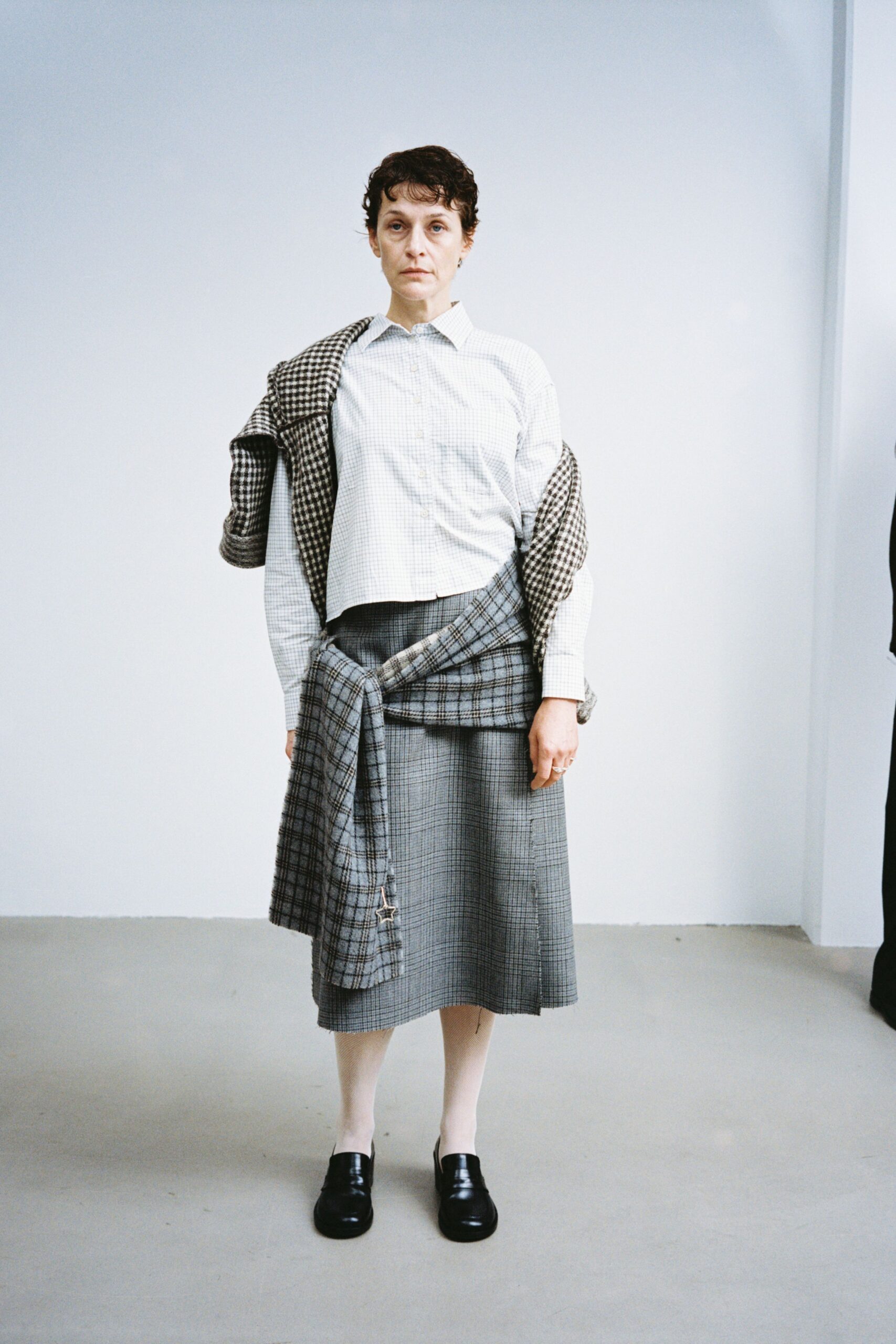 white relaxed shirt with gray midi skirt