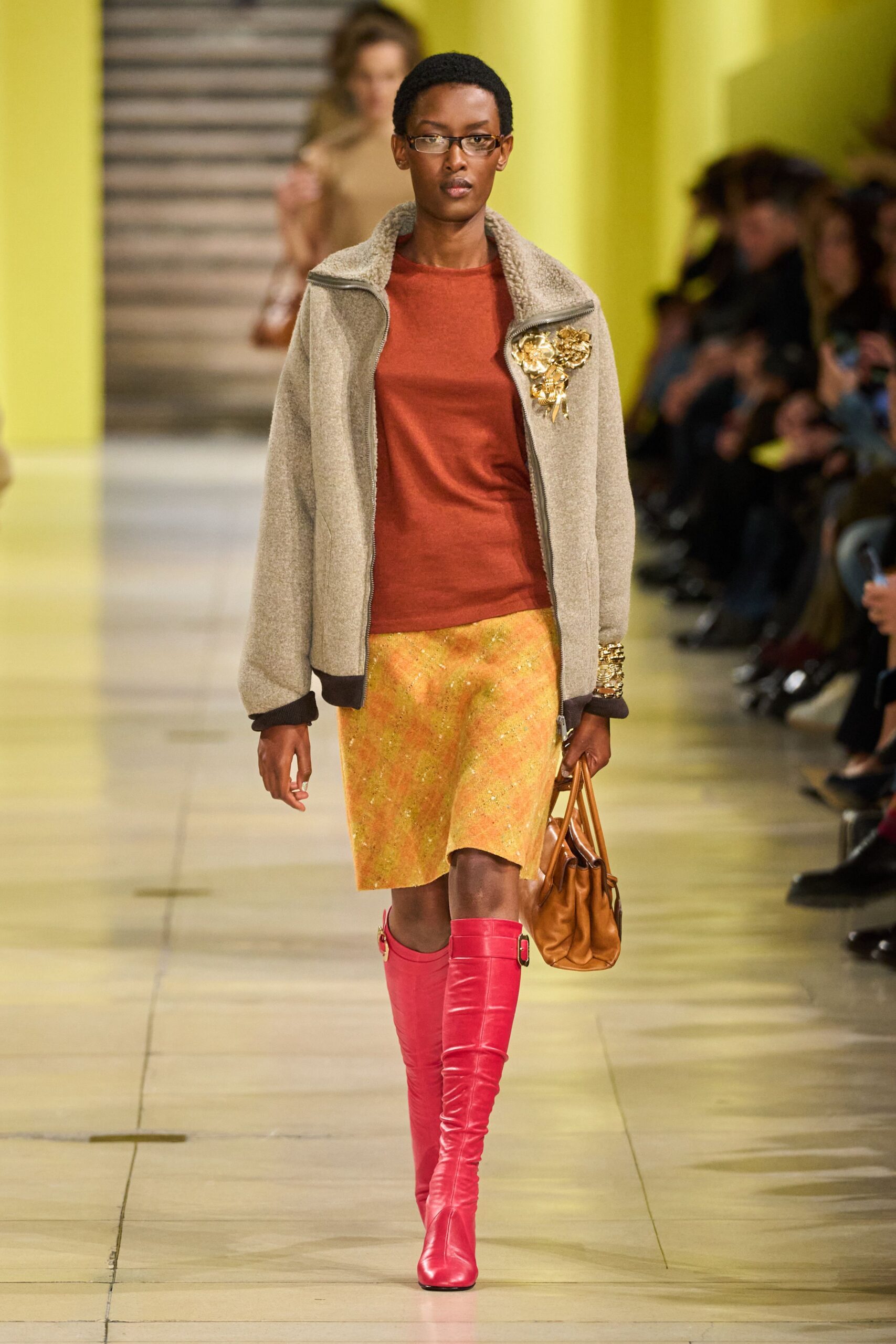 orange fitted top with yellow pleated skirt