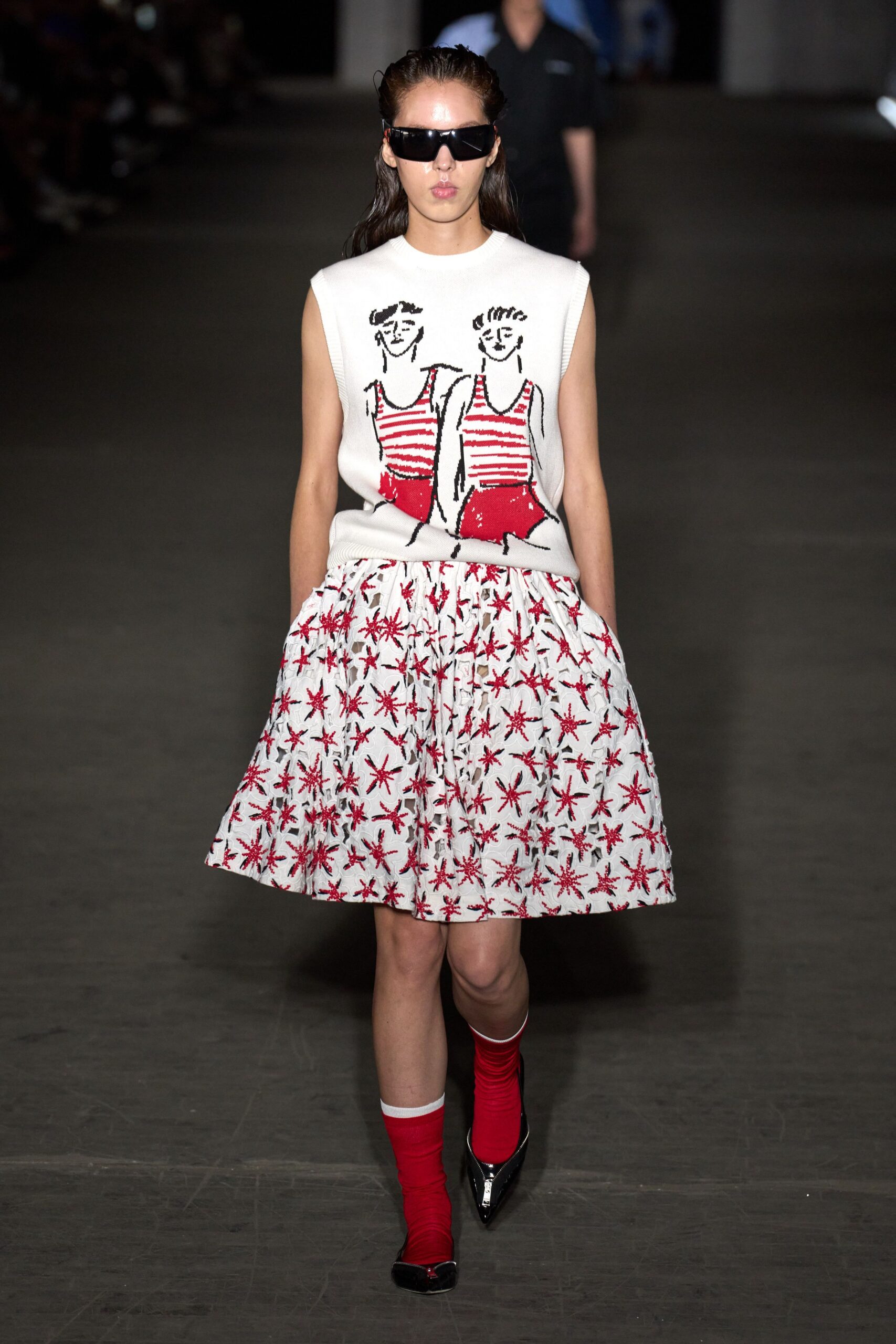red and white printed top with pleated skirt