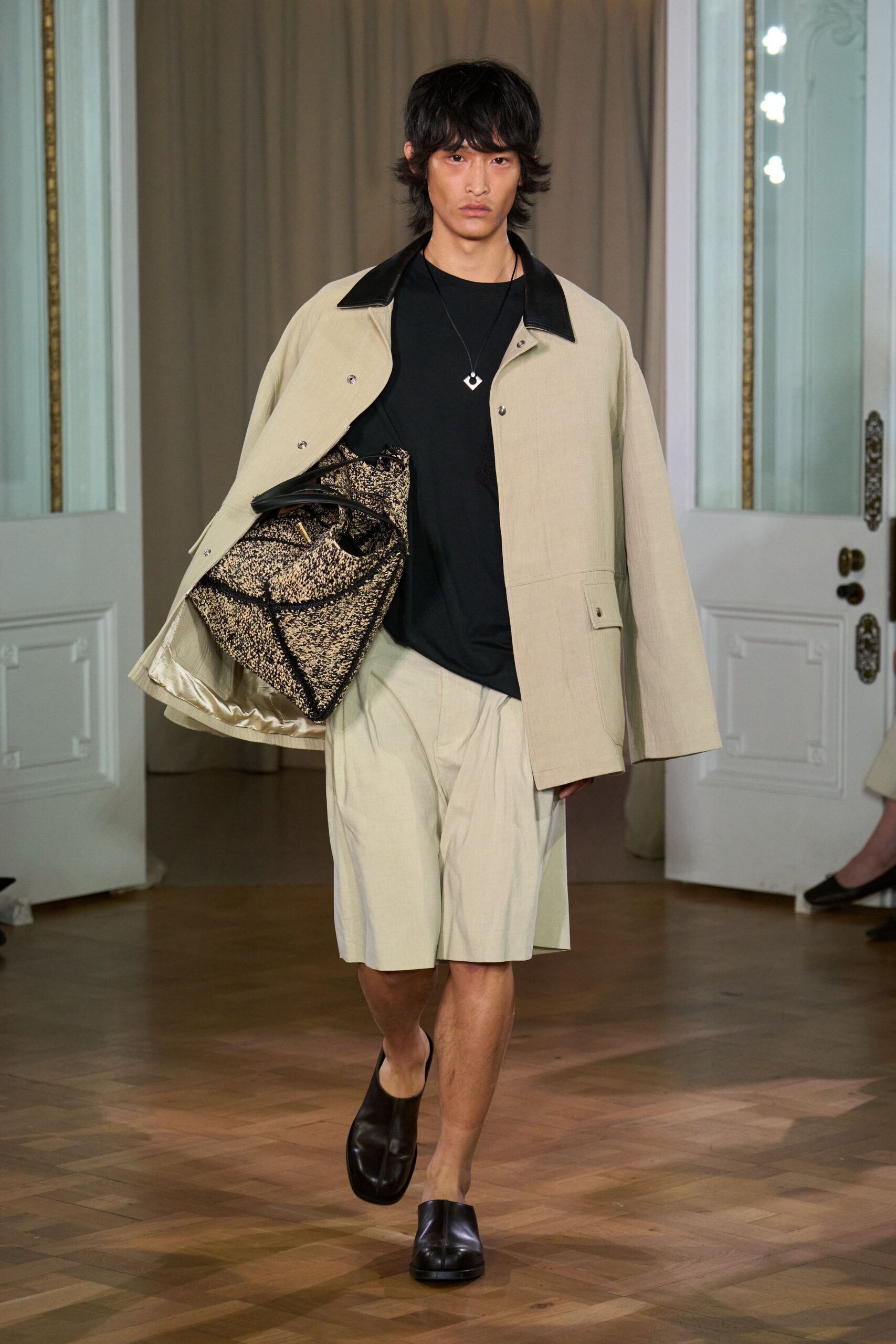 beige jacket black t-shirt beige shorts