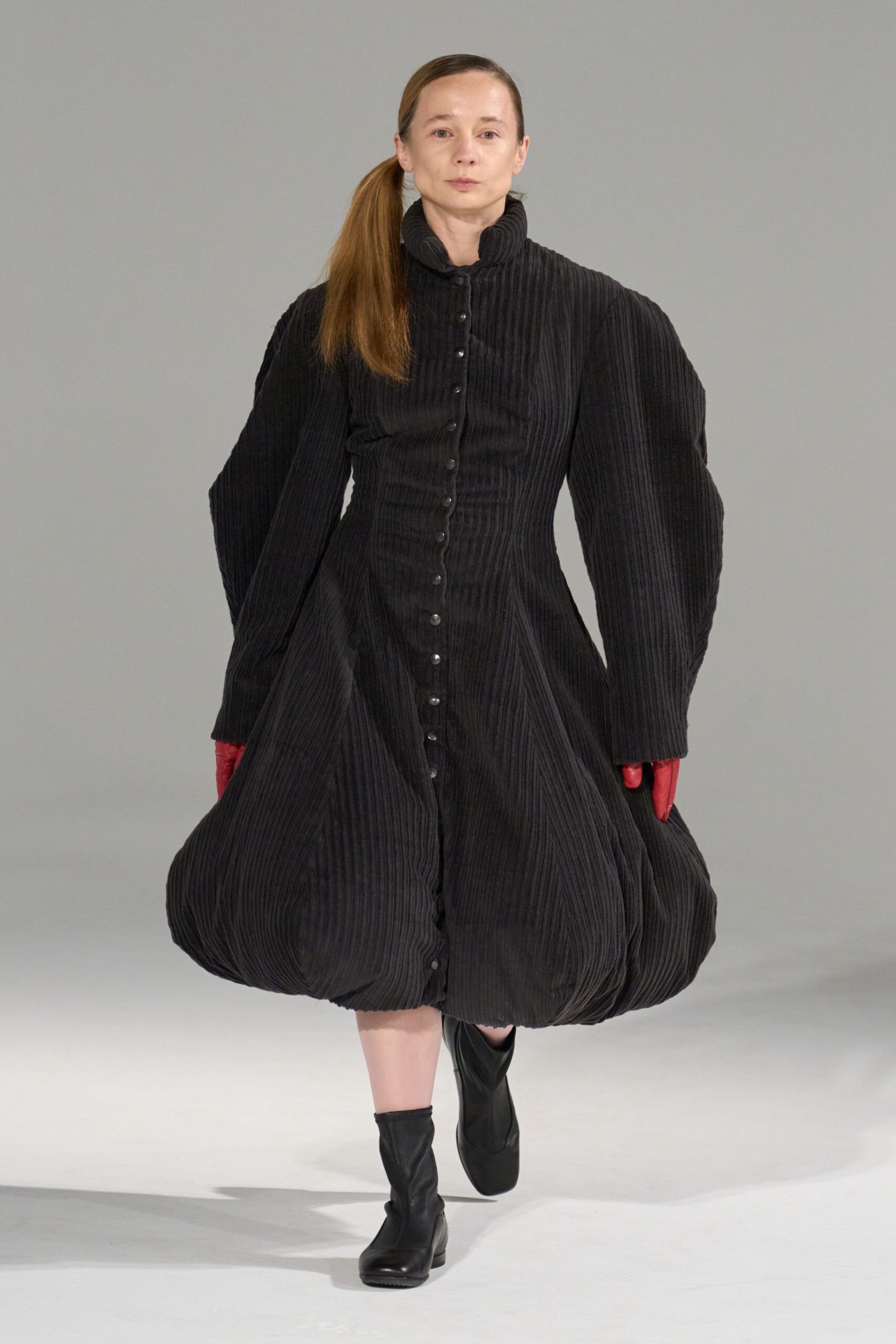 black midi dress with red gloves