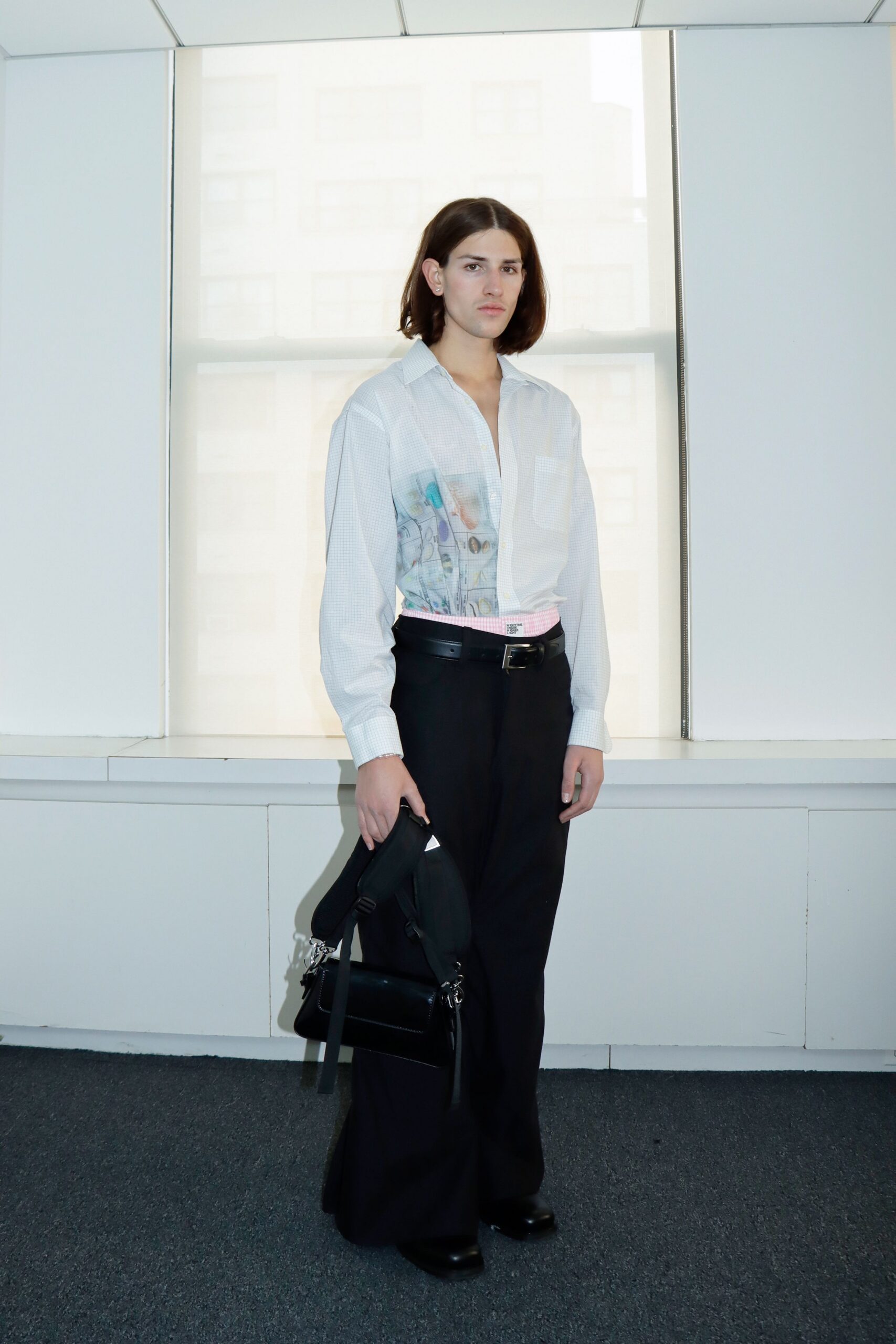 white relaxed shirt with black pants