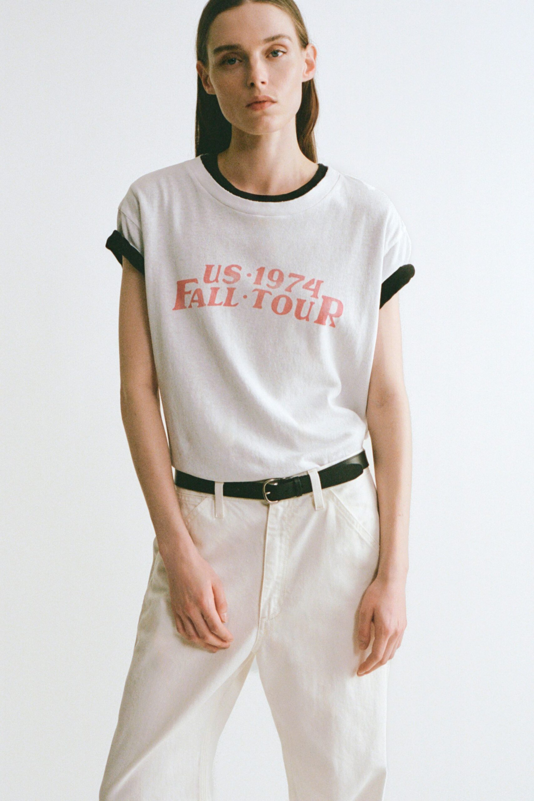 white printed t-shirt with beige pants