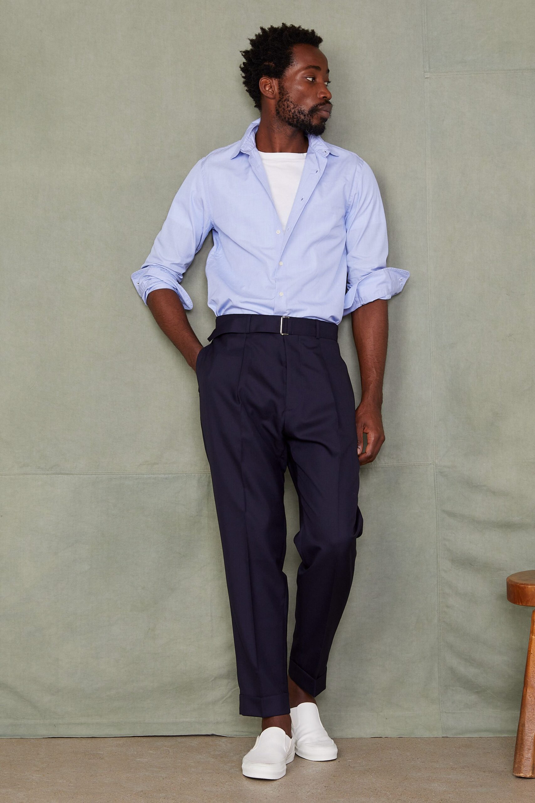 blue shirt white t-shirt black pants white shoes
