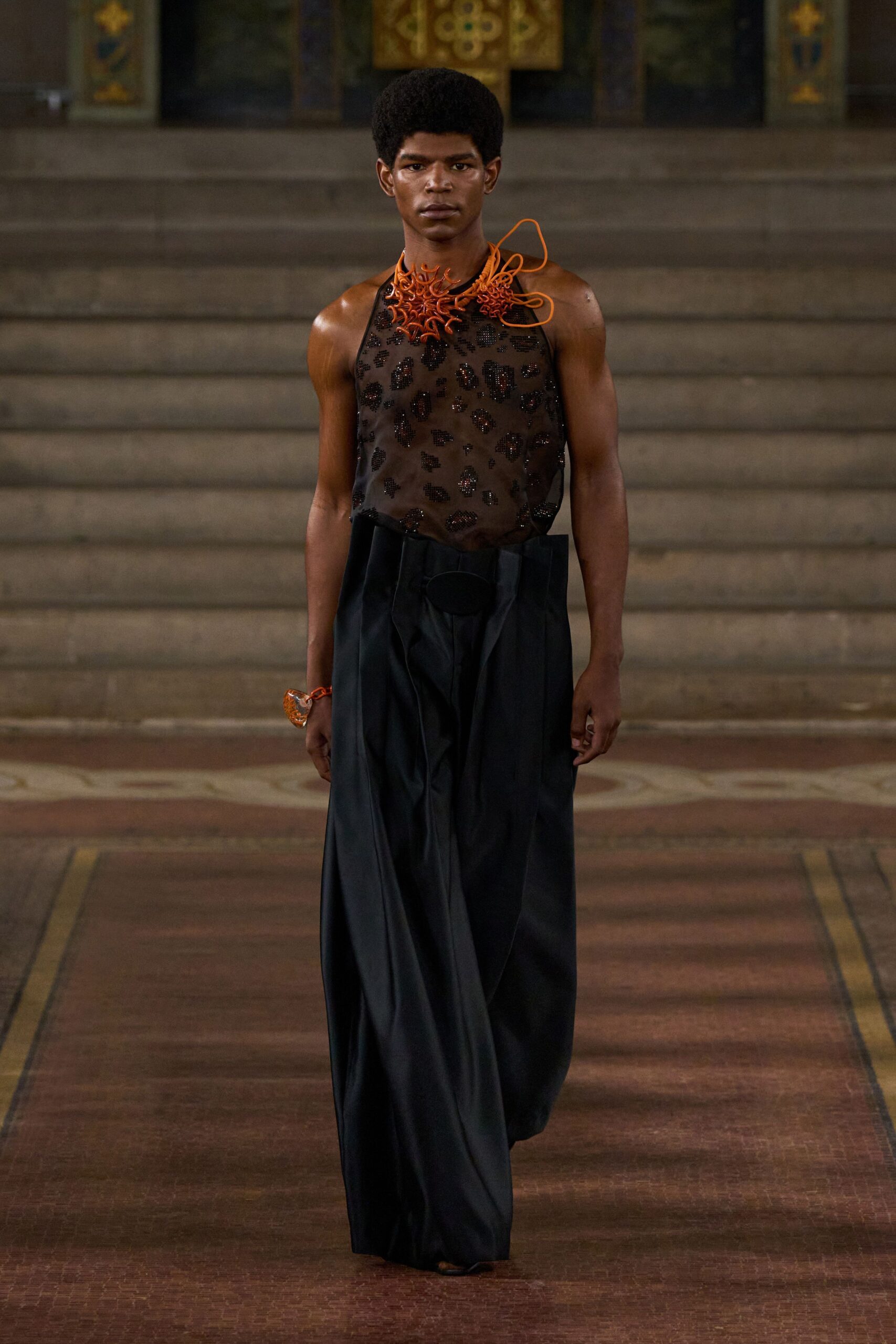 black mesh top with wide-leg pants