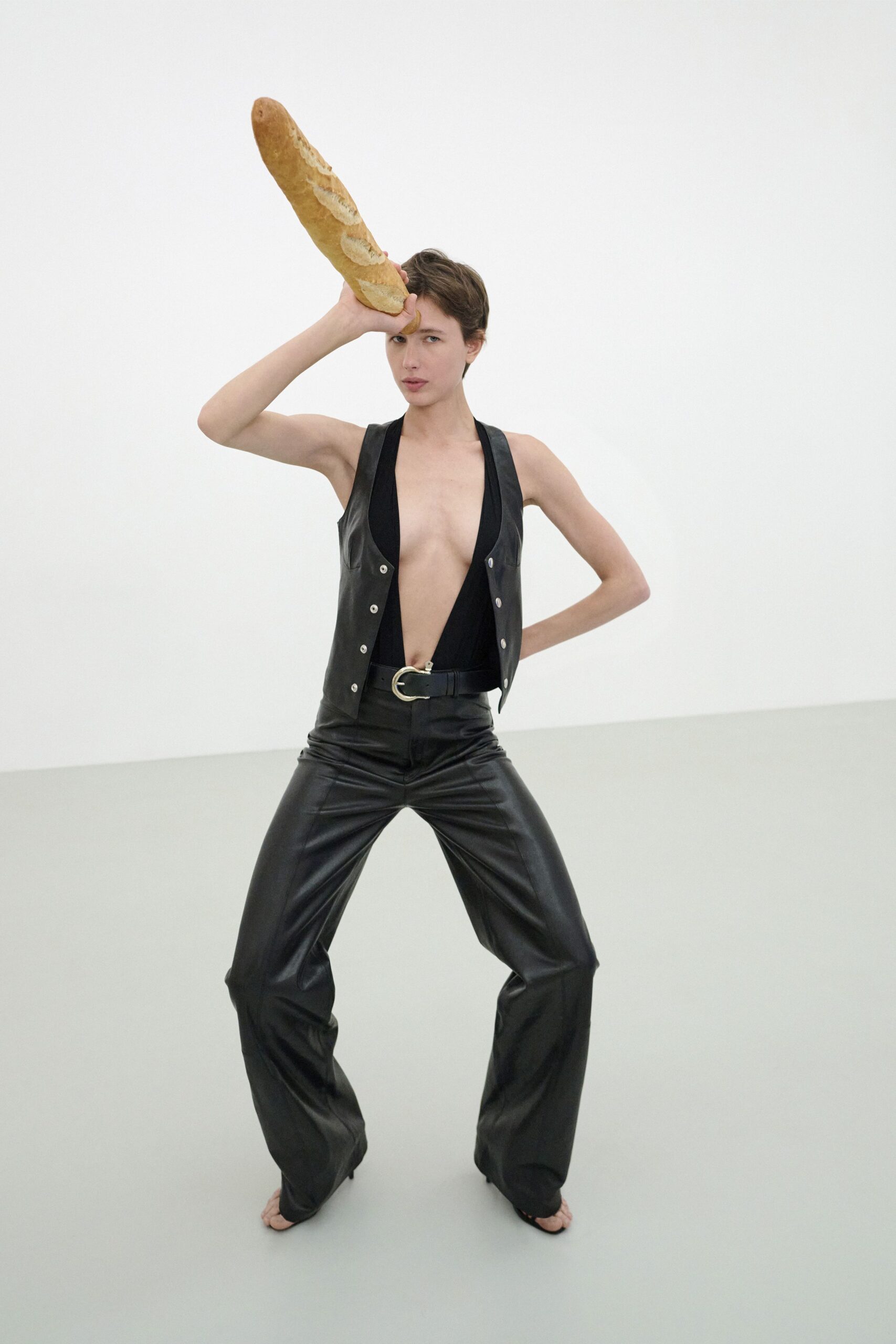 black leather sleeveless v-neck fitted buttoned vest