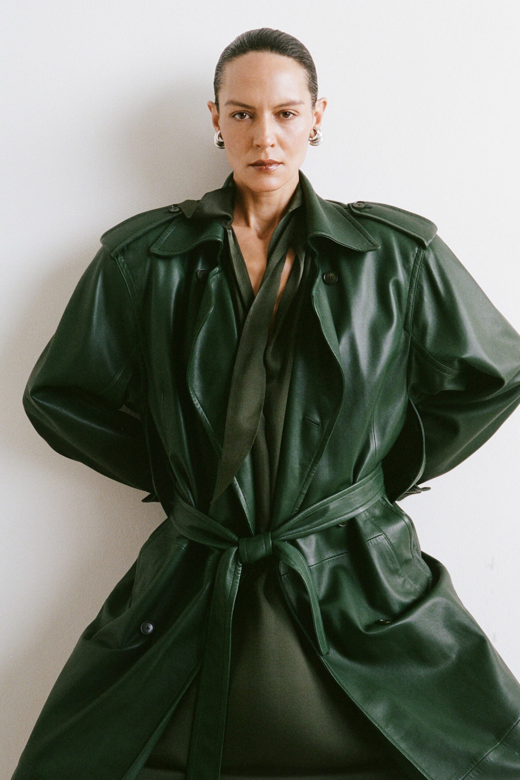 green leather long-sleeve collared relaxed belted coat