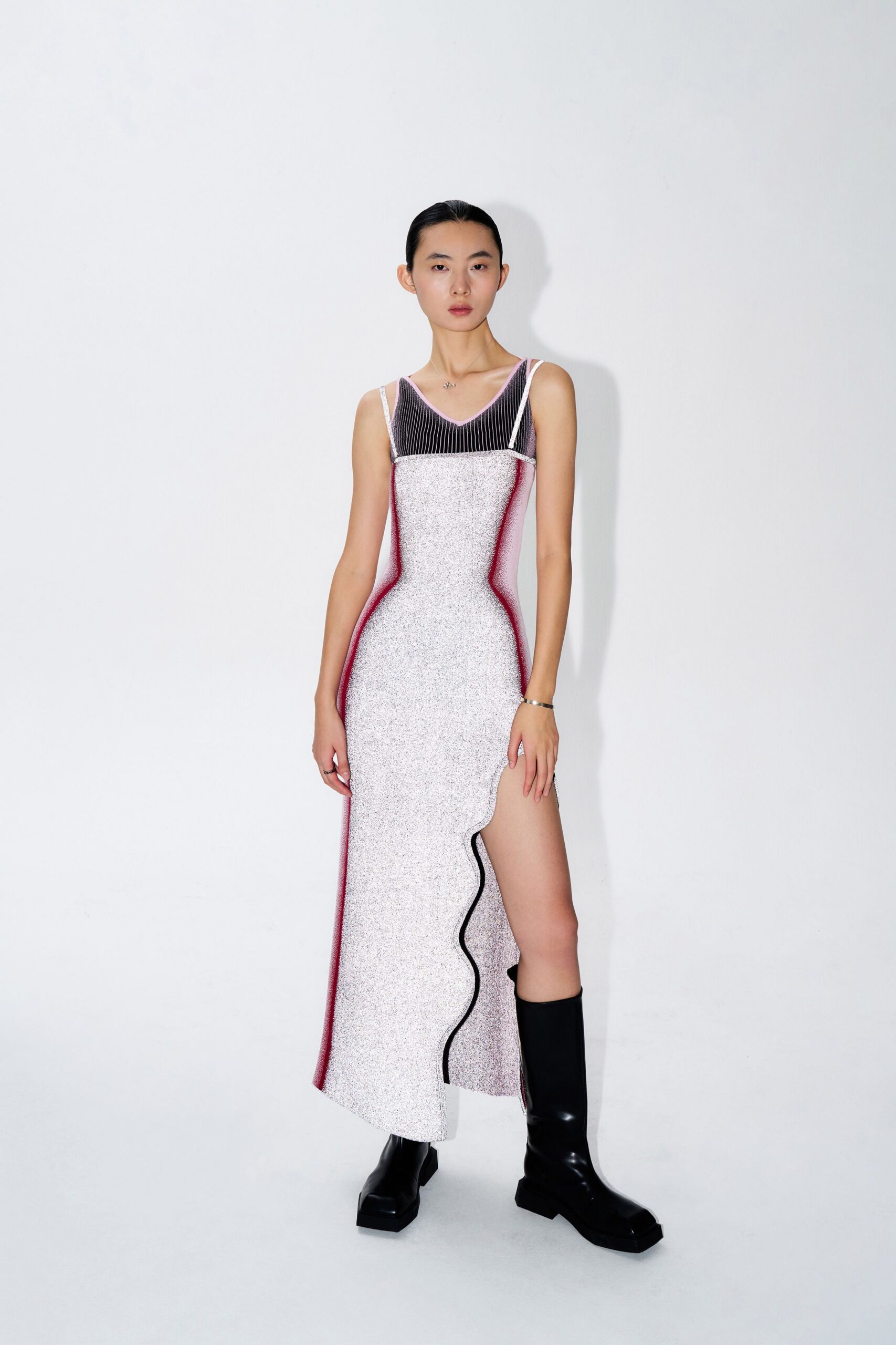fitted asymmetric white dress with black boots