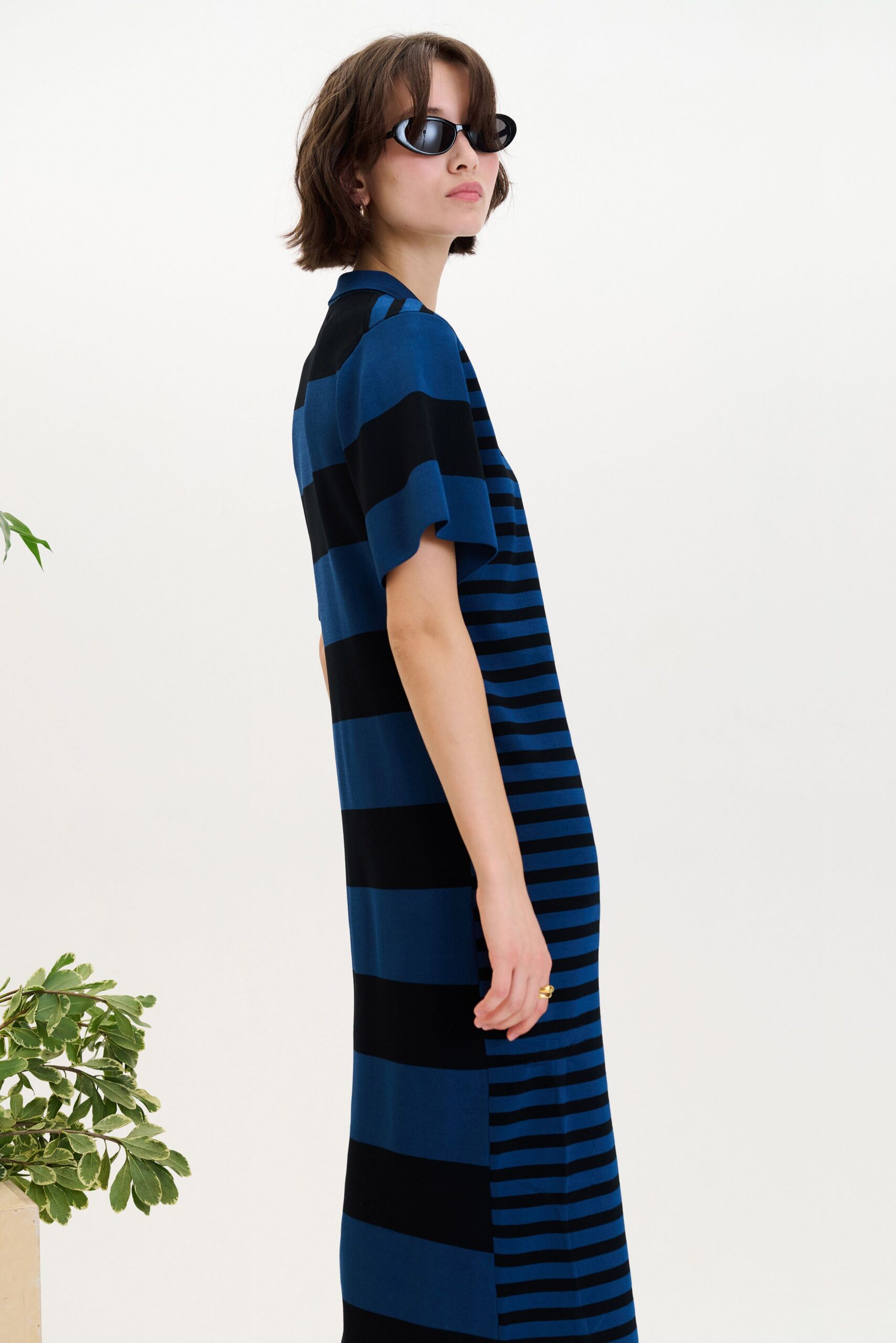 blue and black striped maxi dress with sunglasses