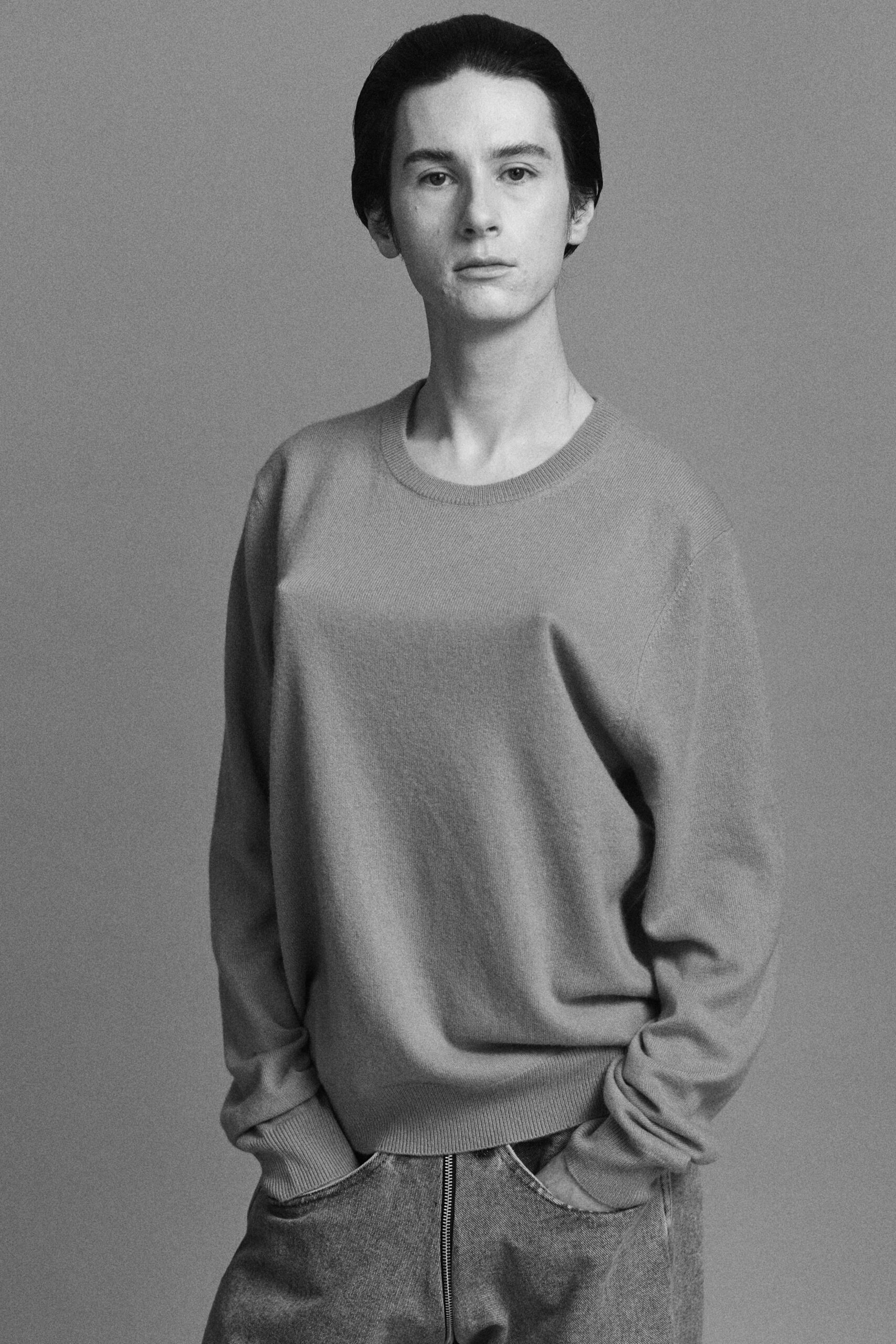 gray relaxed sweater with blue pants