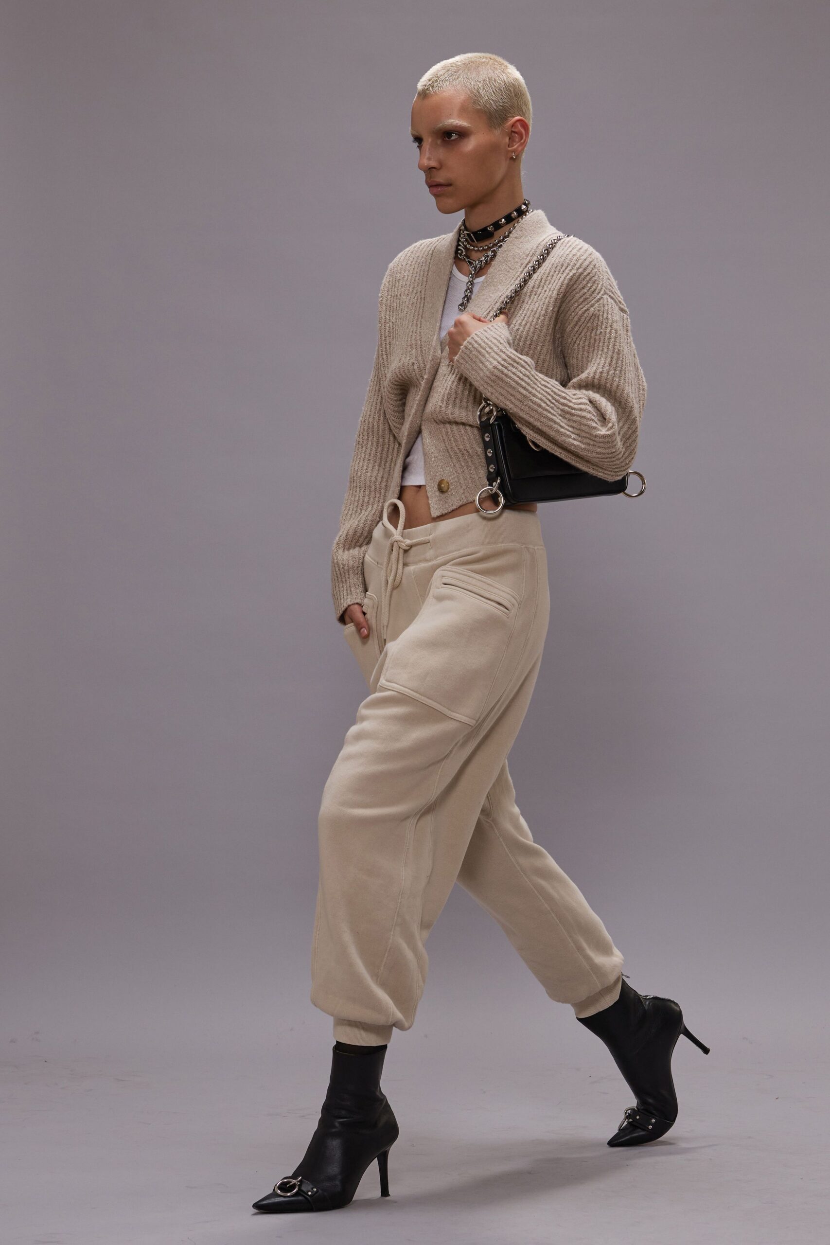 beige cardigan cream pants black heels