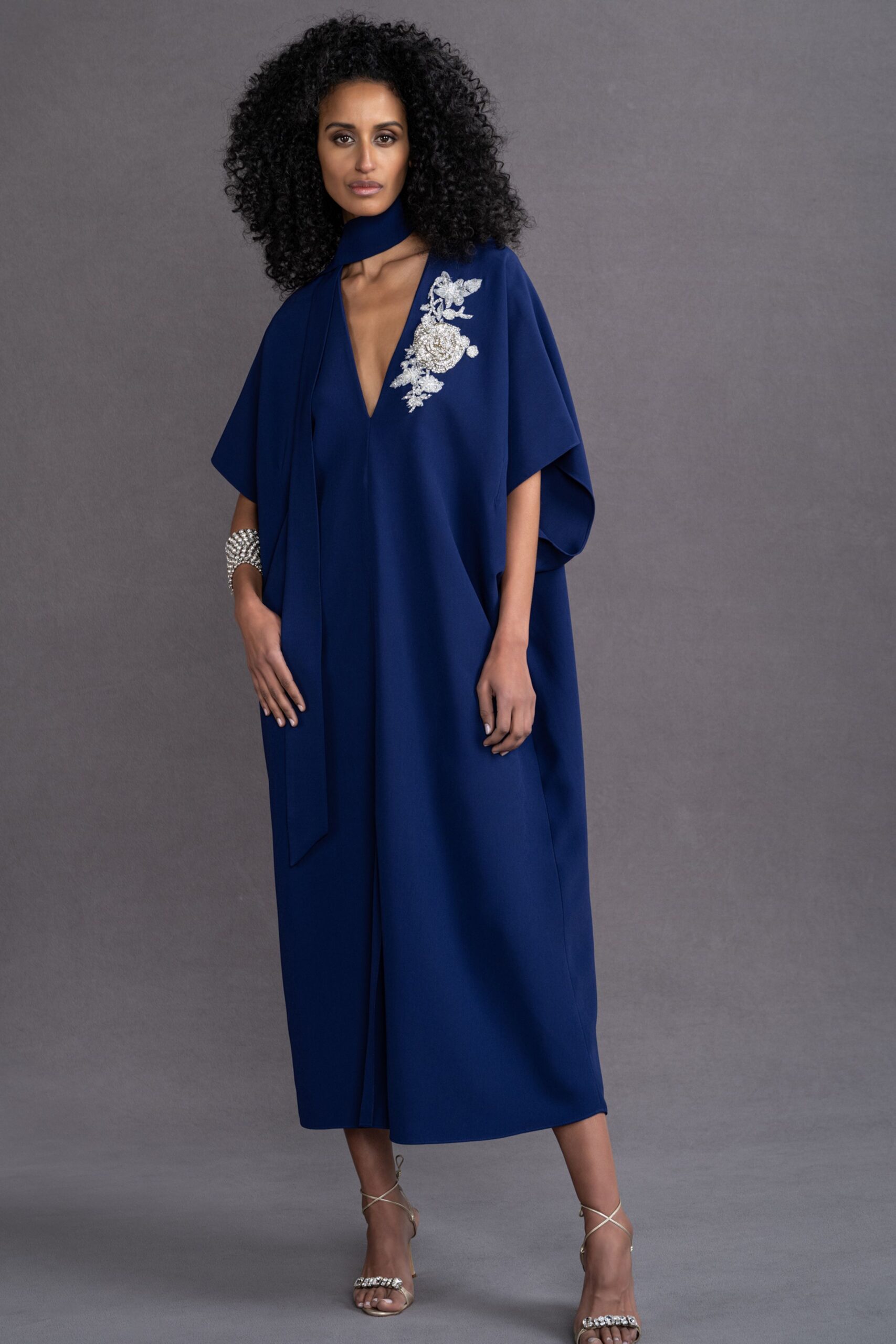blue silk sleeveless gown