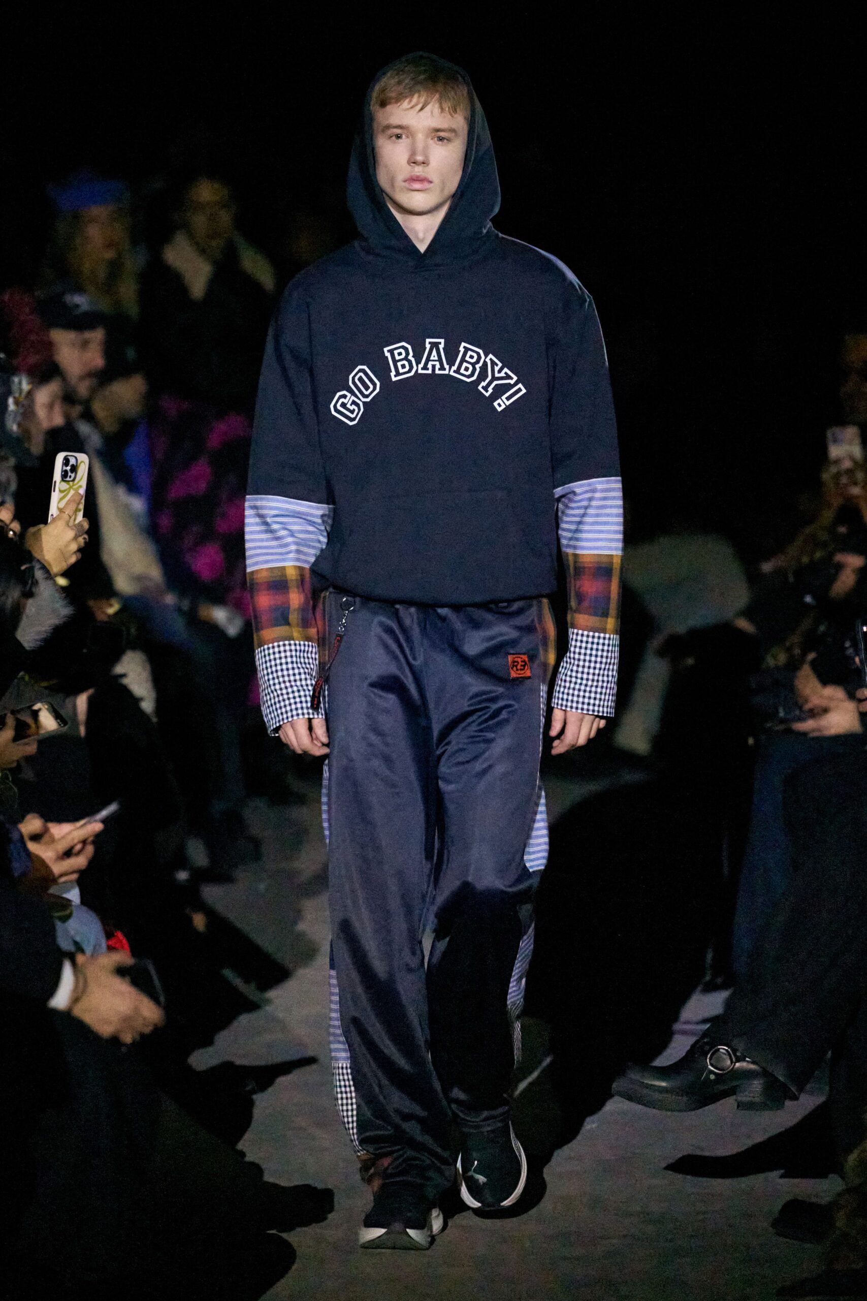 black hoodie with blue pants