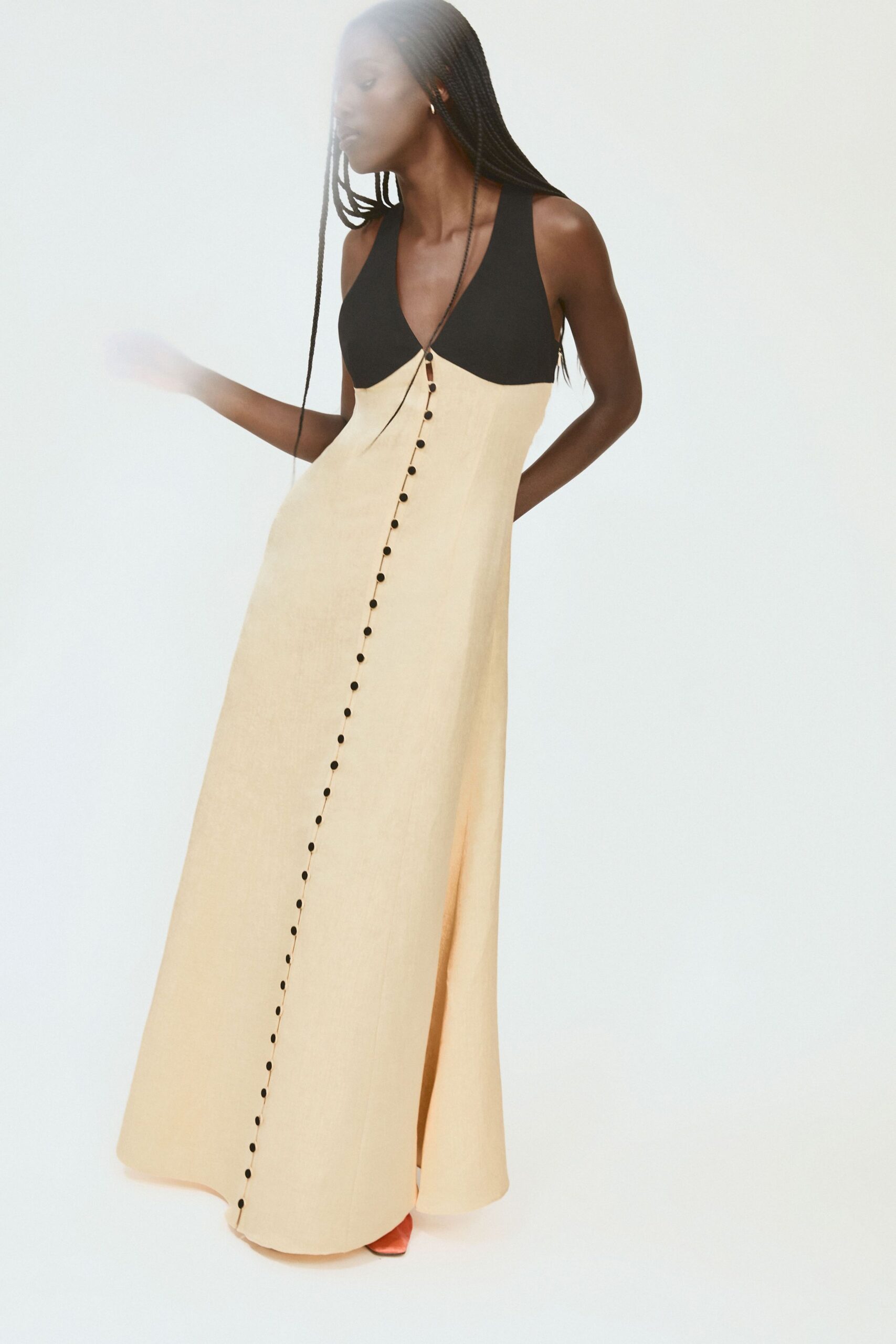 beige cotton sleeveless v-neck fitted buttoned a-line gown