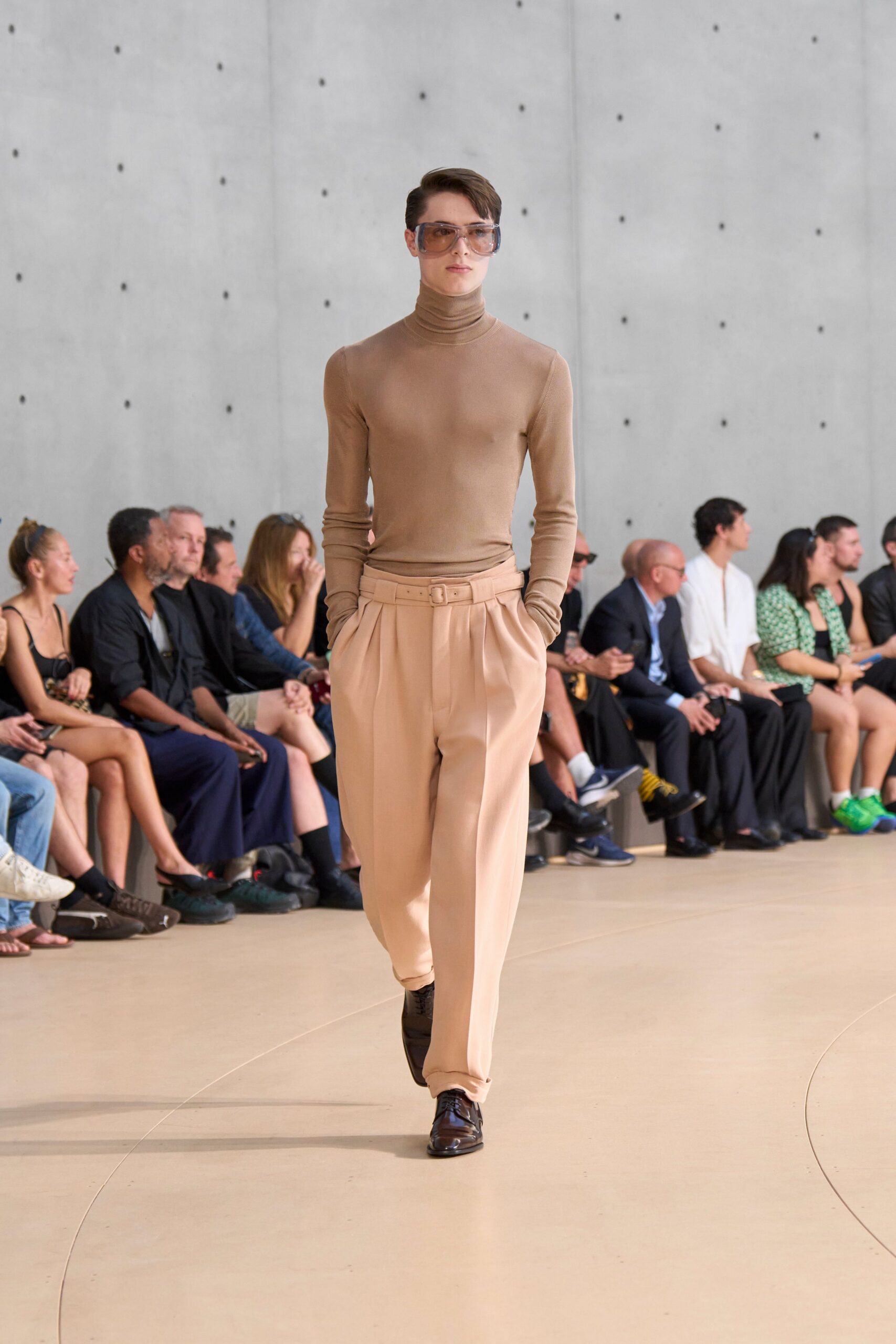 beige fitted turtleneck top with relaxed peach pants