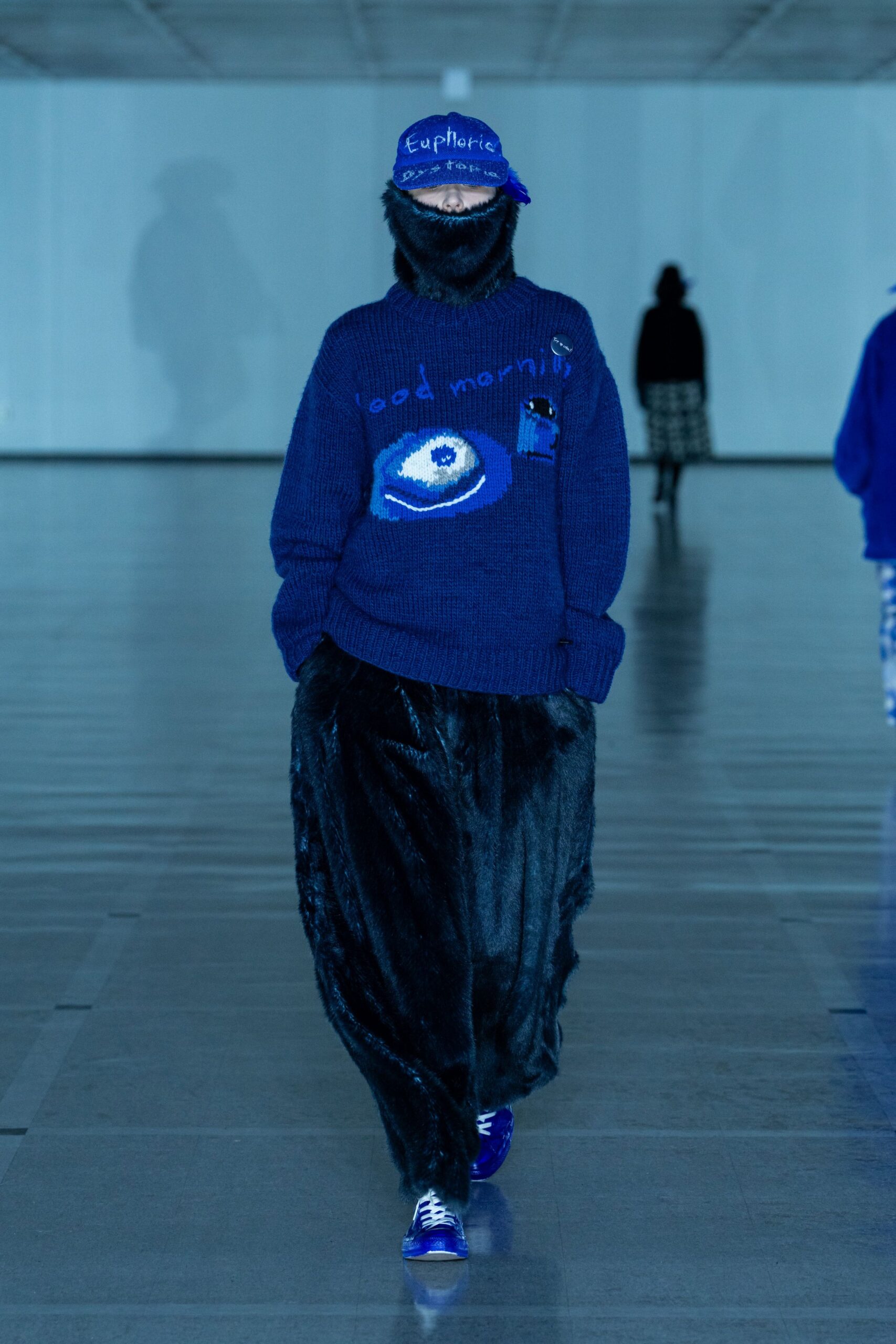 blue relaxed sweater with black pants