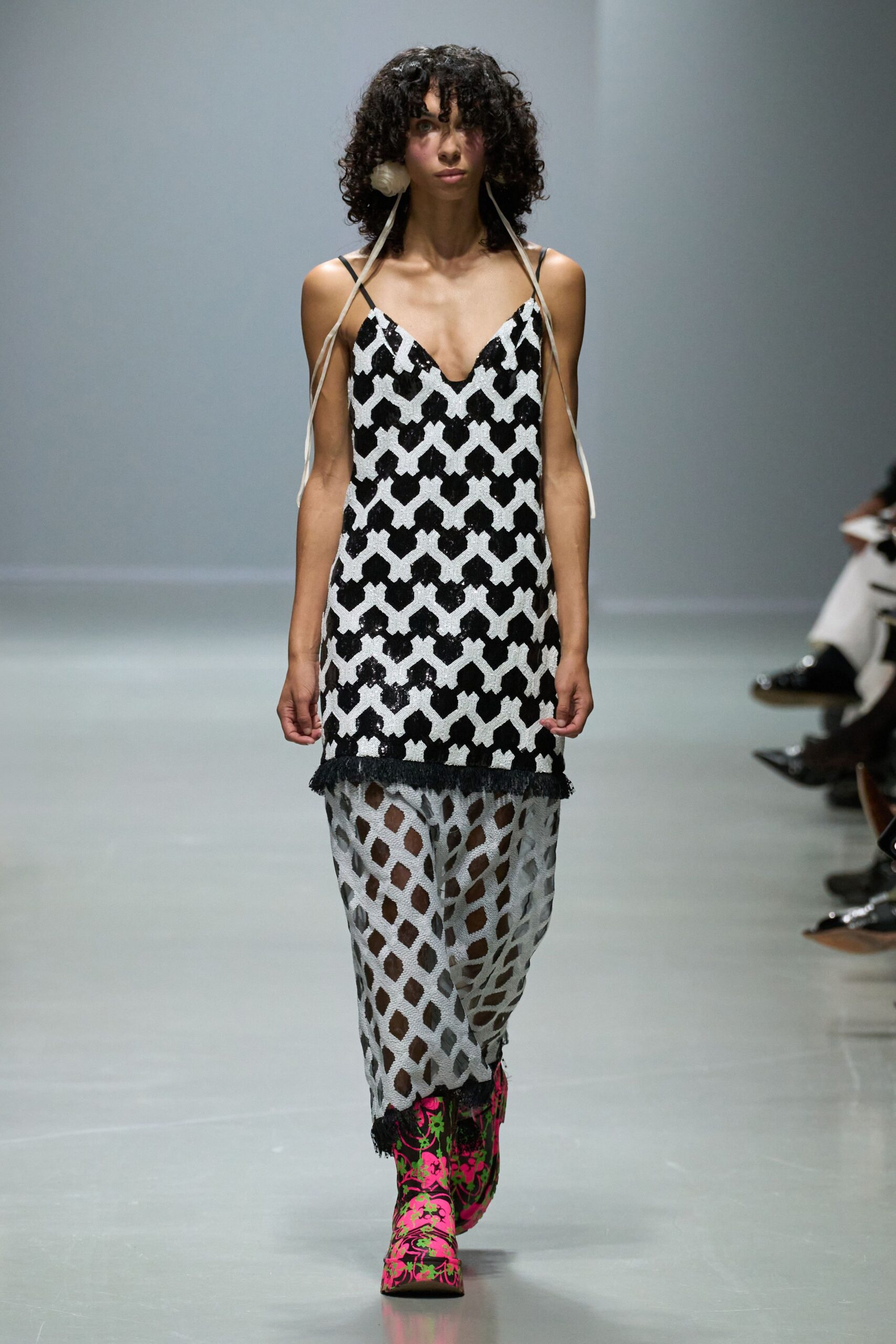 black and white printed midi dress with pink boots