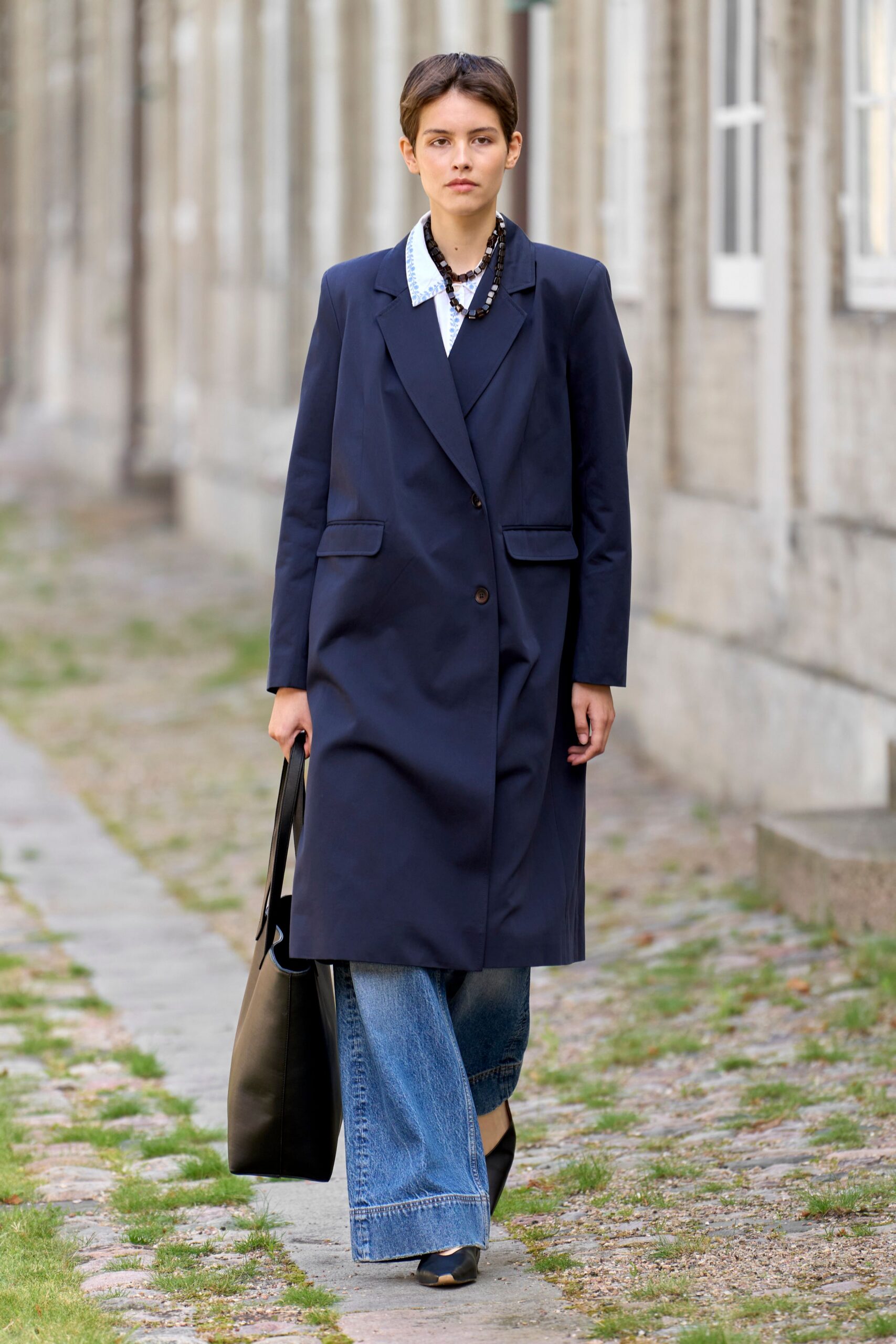 blue coat white shirt denim pants