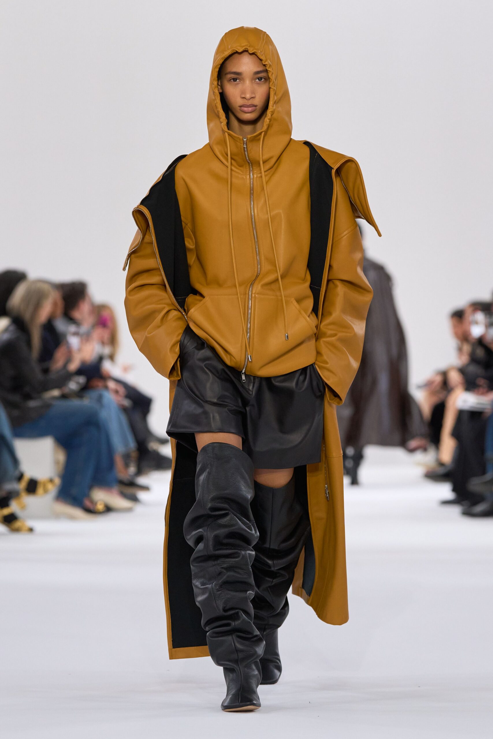 brown leather oversized hoodie with black shorts