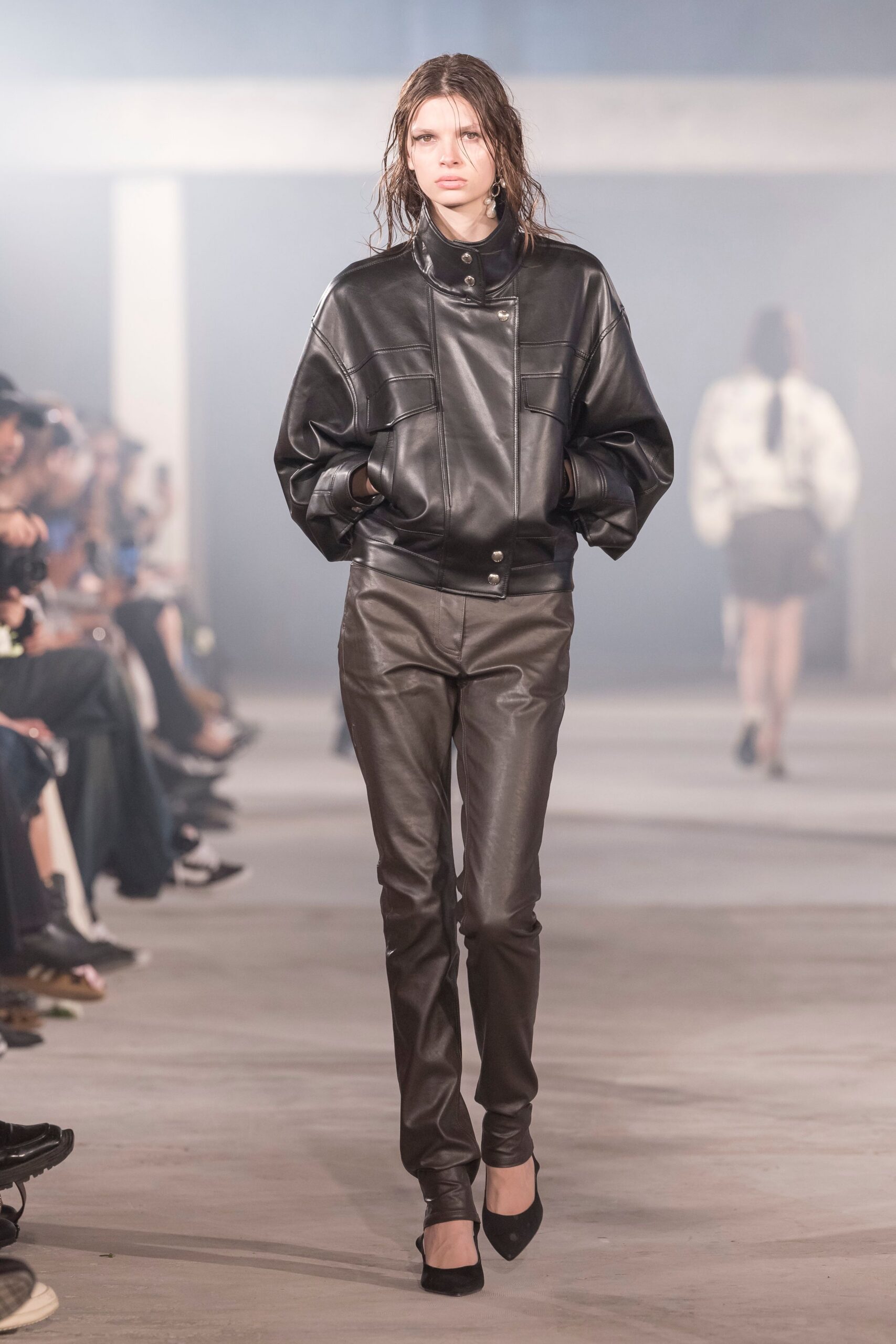 black leather oversized jacket and fitted pants