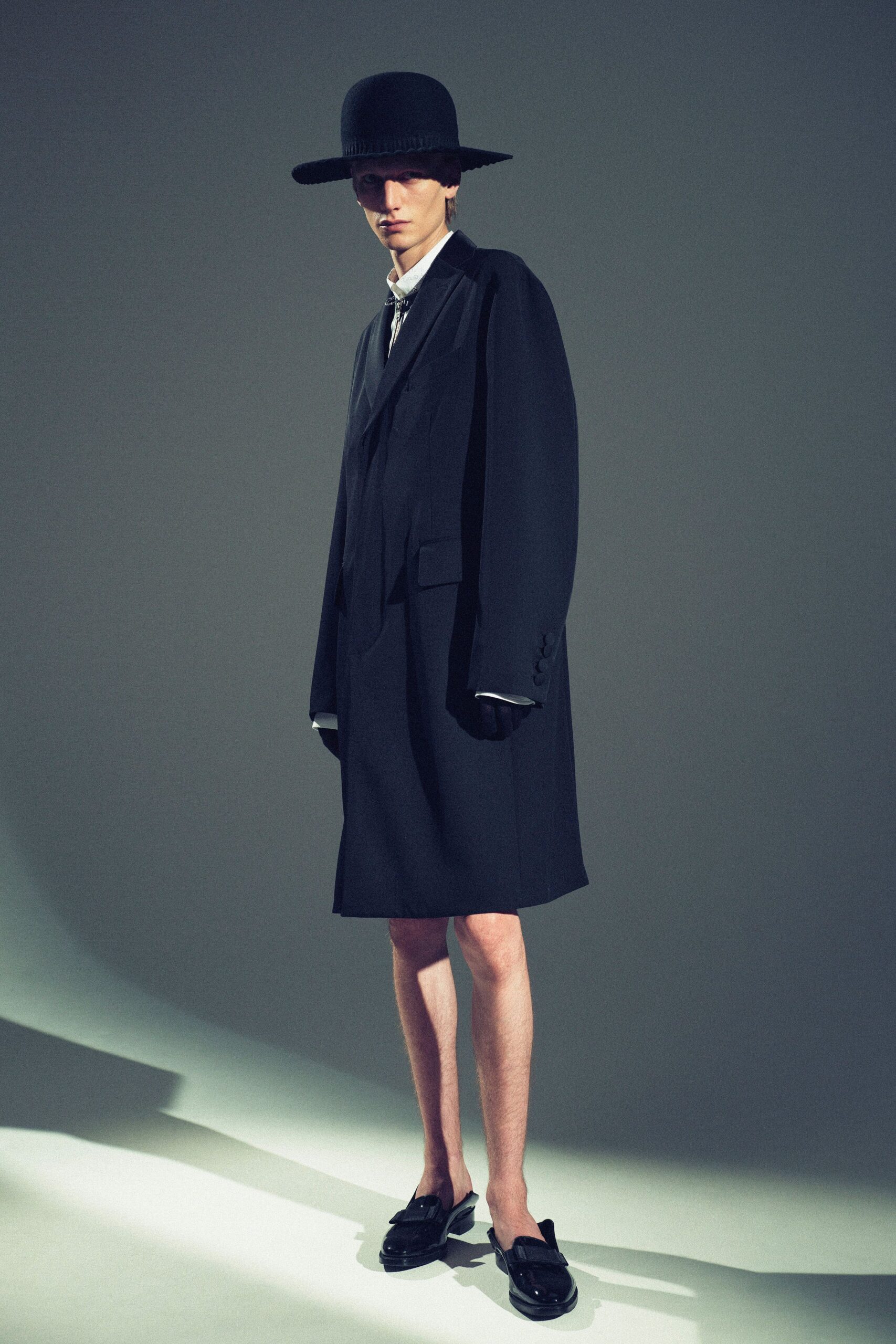 black wool long-sleeve collared oversized buttoned midi coat