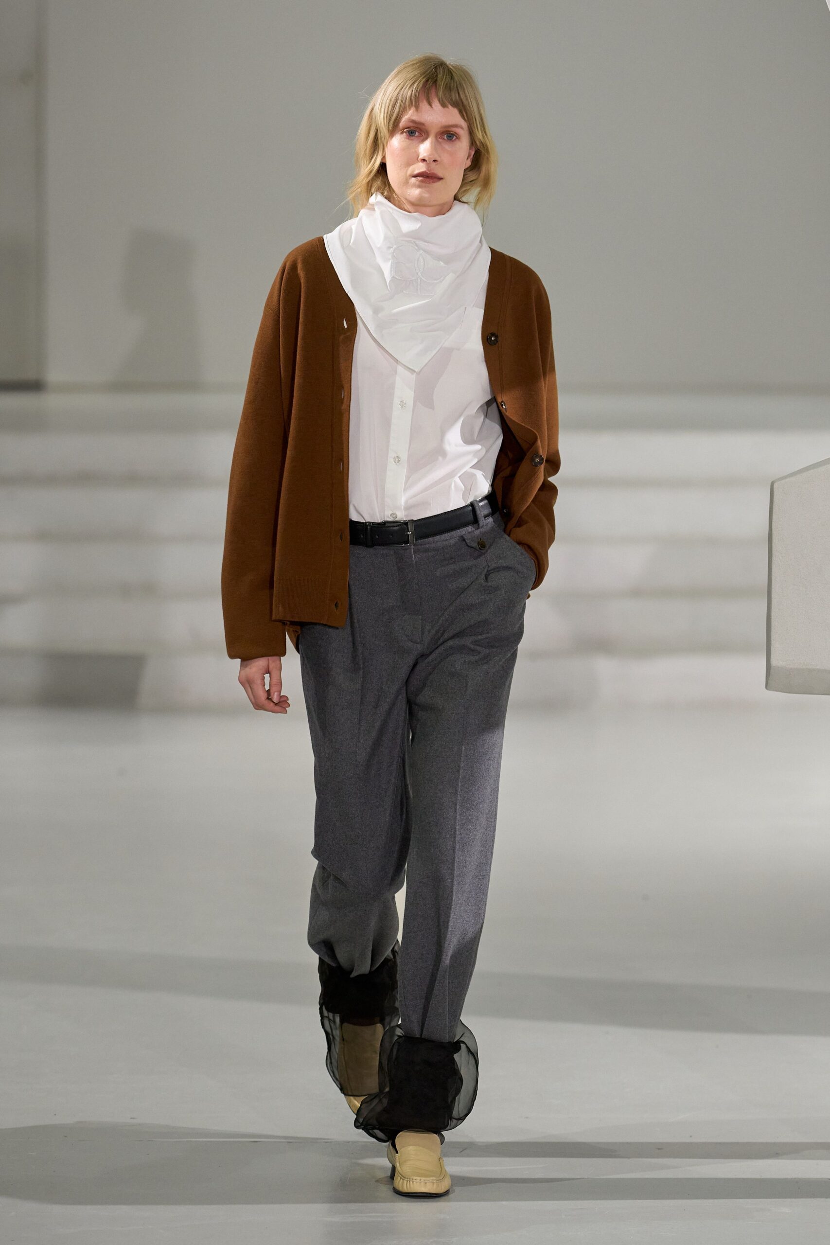 brown cardigan white shirt gray pants