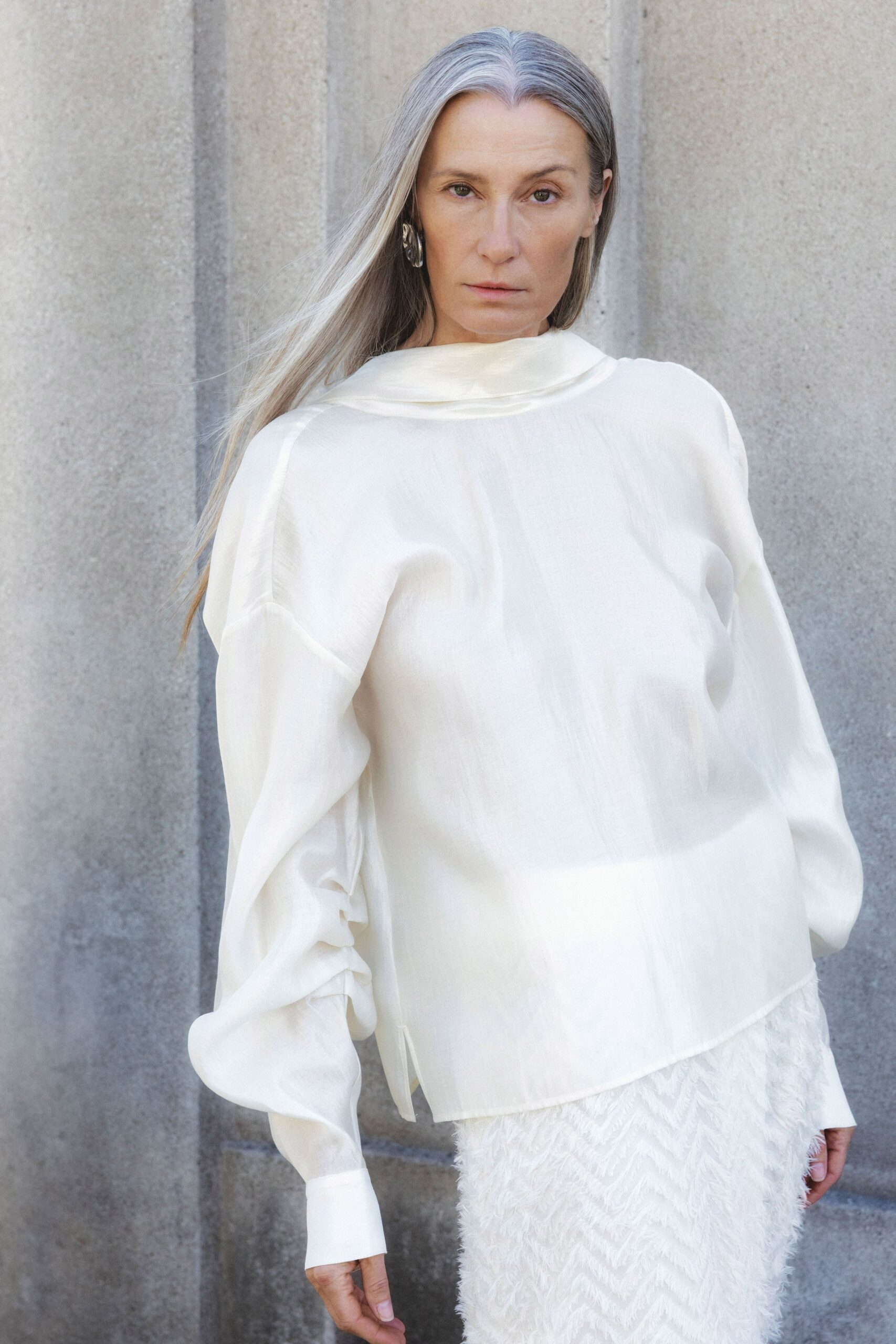 white silk blouse and tiered skirt