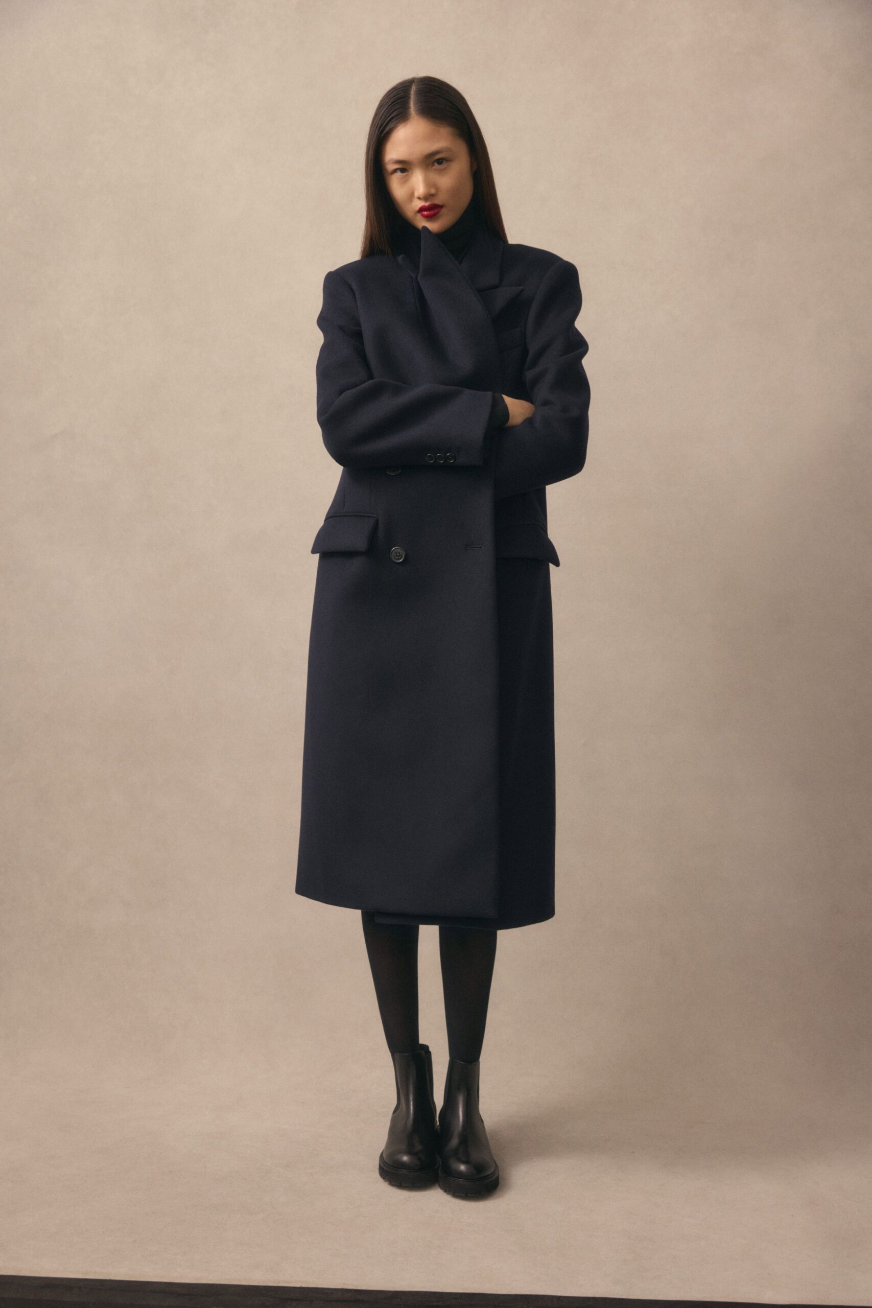 black wool long-sleeve collared structured buttoned midi coat
