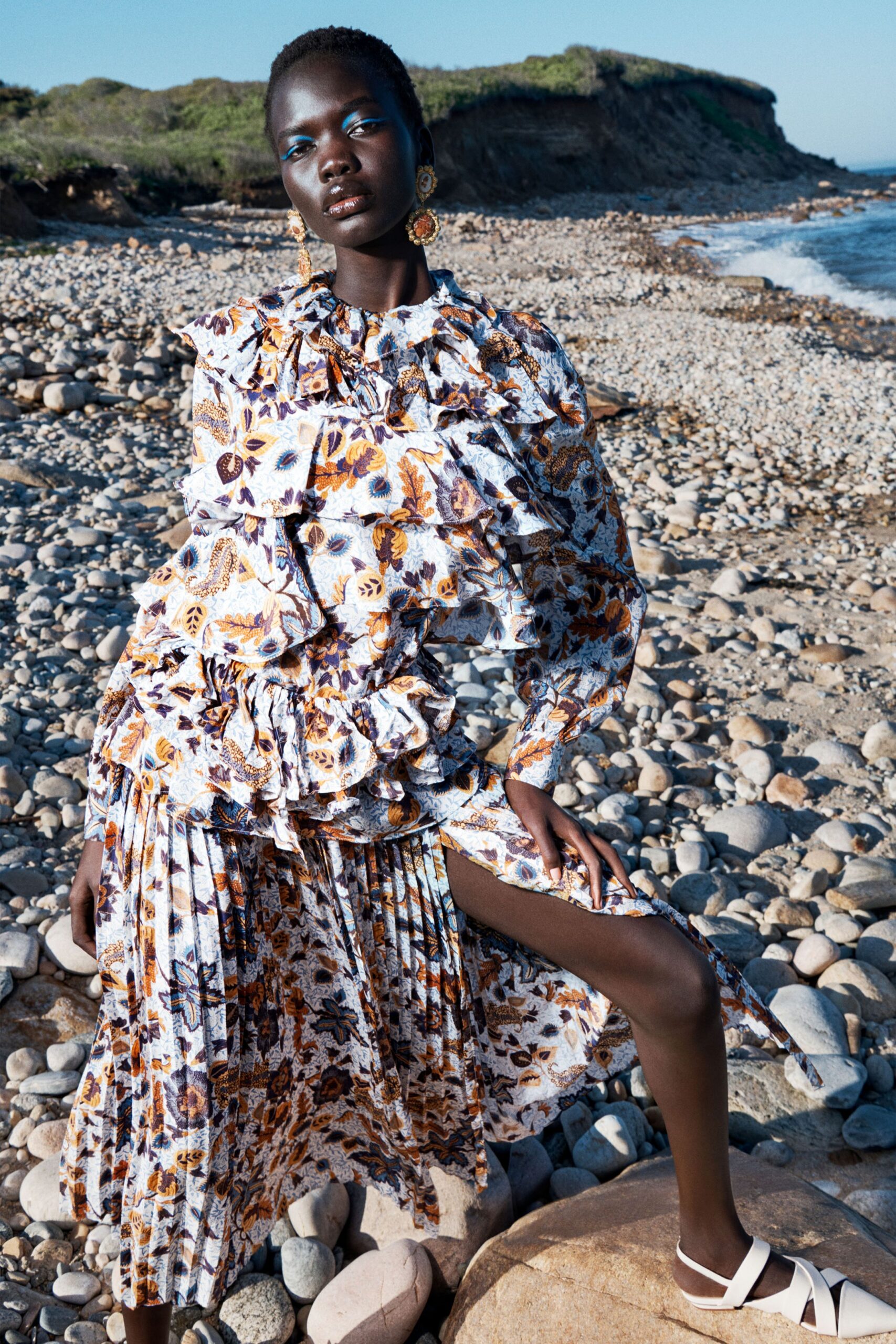 white cotton long-sleeve collared fitted floral pleated dress