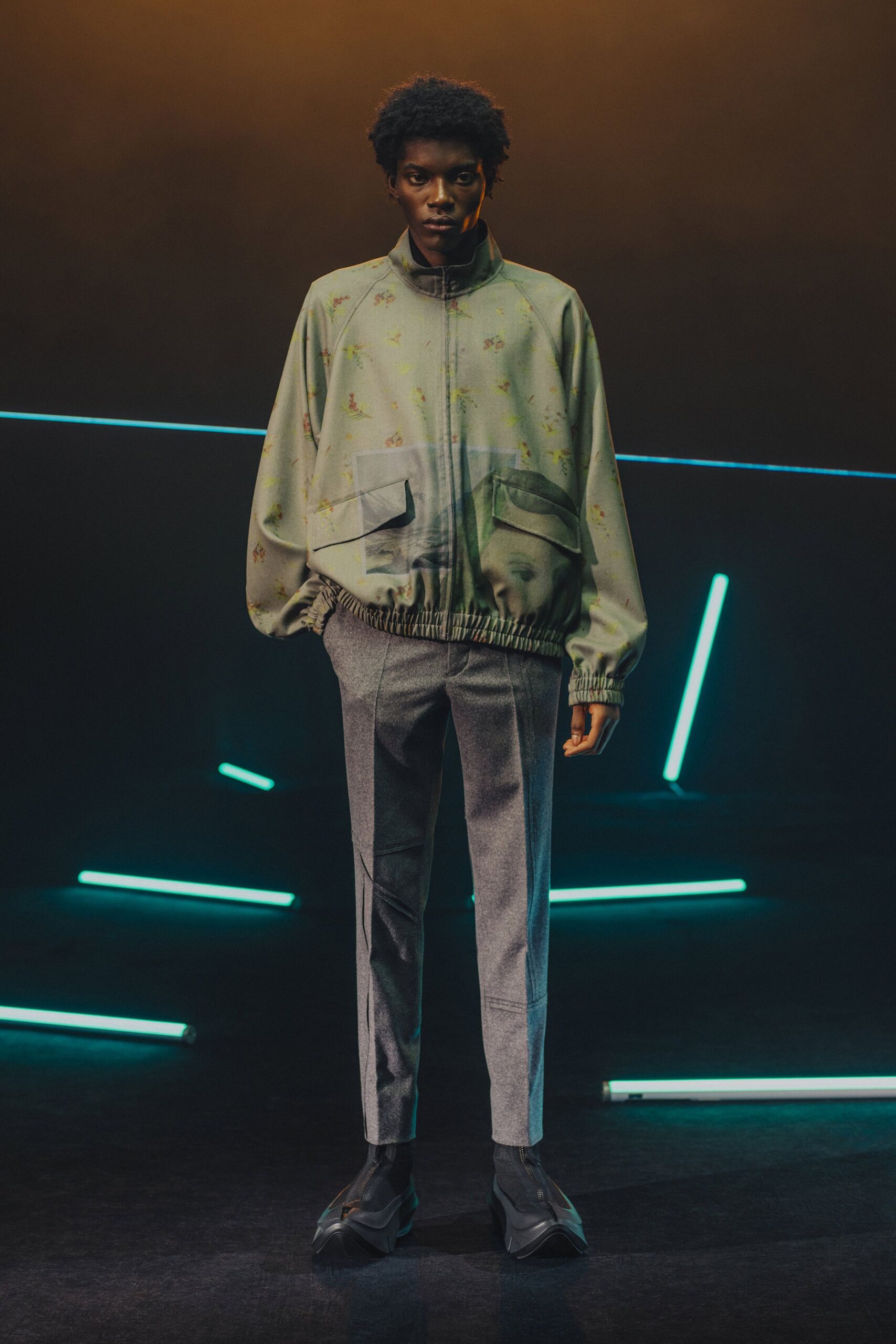 green printed relaxed jacket with gray tailored pants