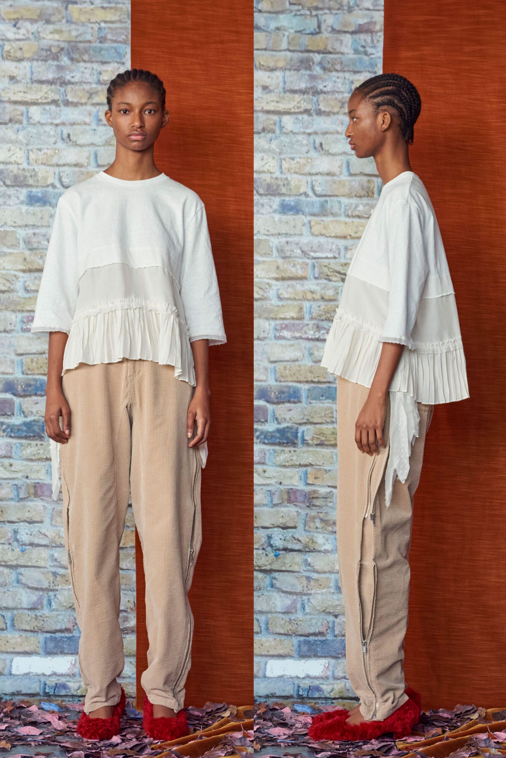 white relaxed top beige pants red shoes