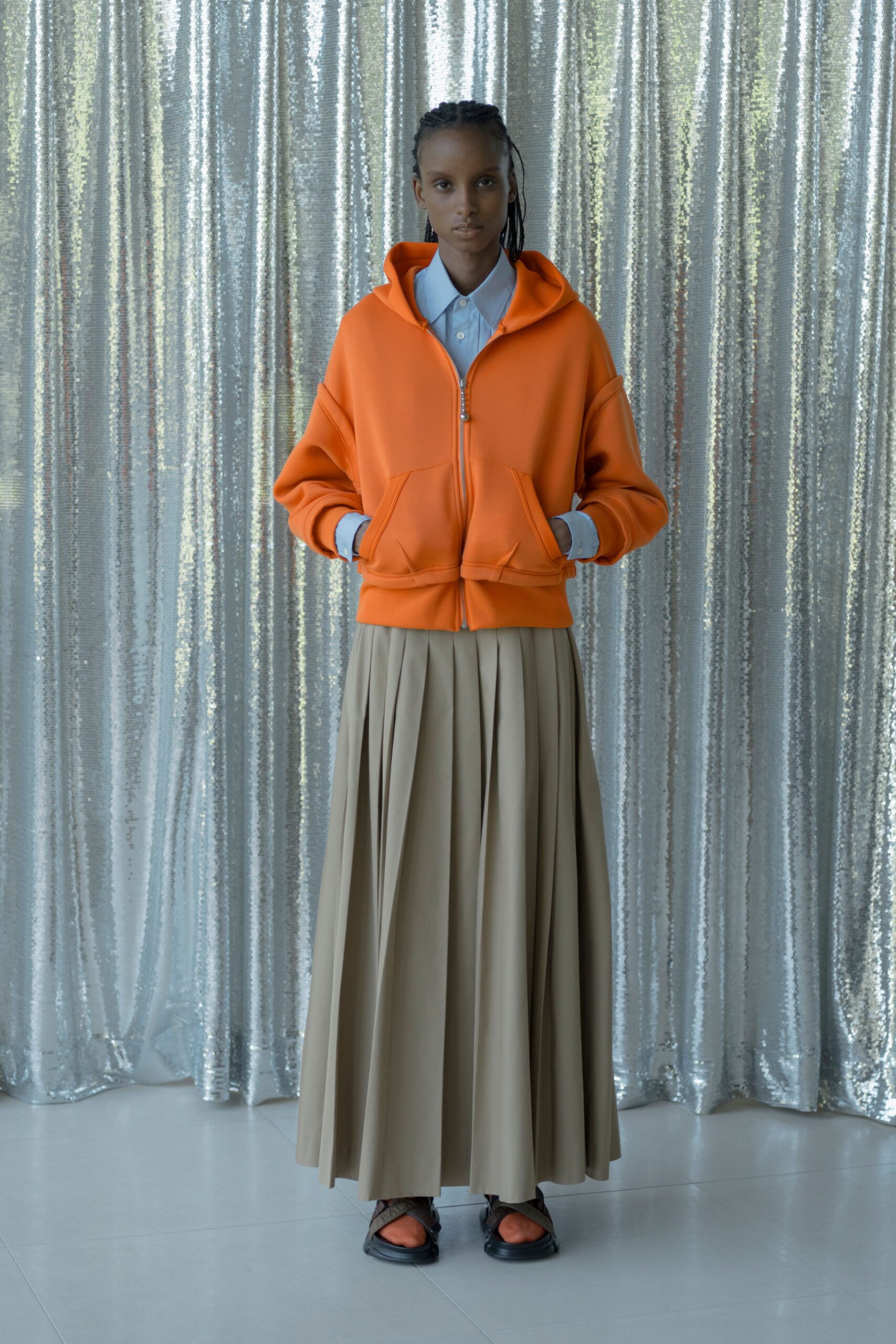 orange hoodie beige pleated skirt