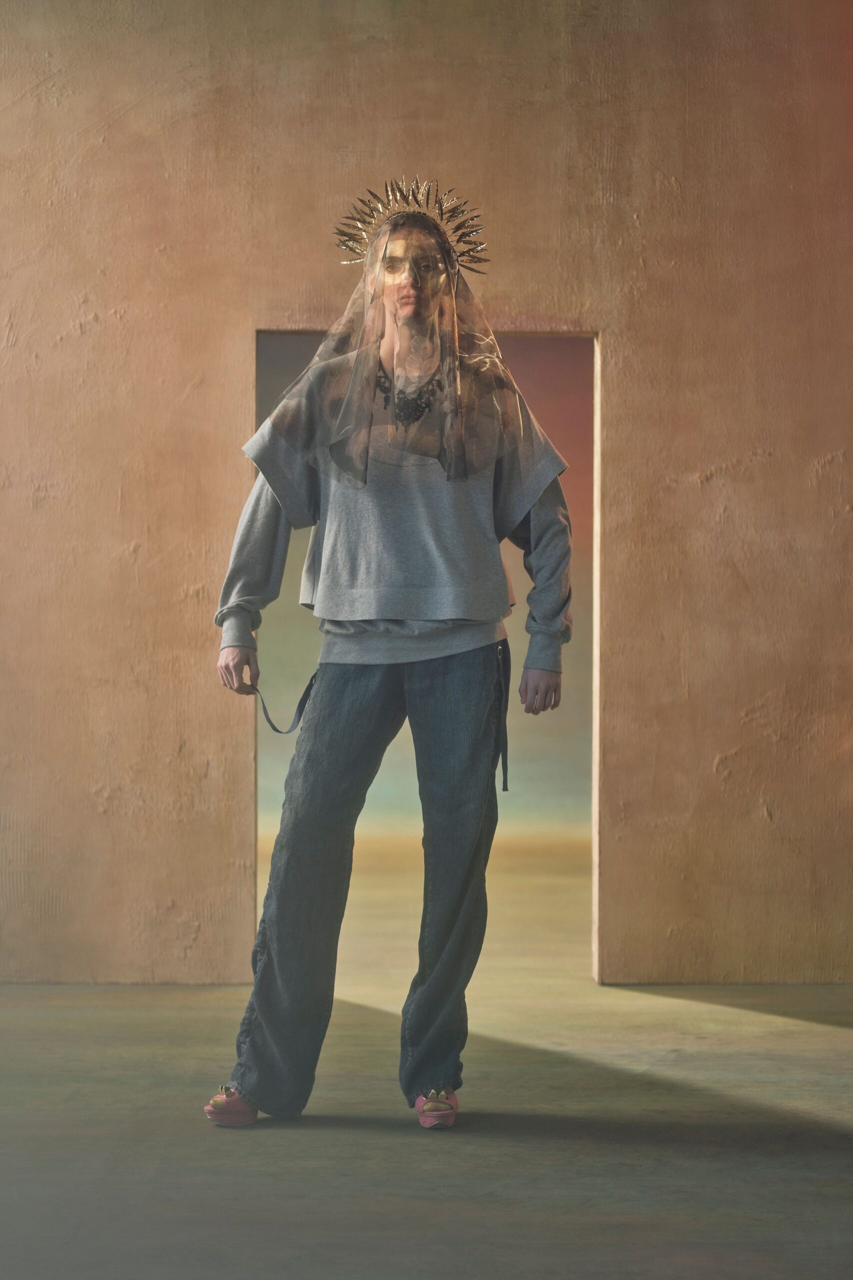 gray relaxed top with blue pants