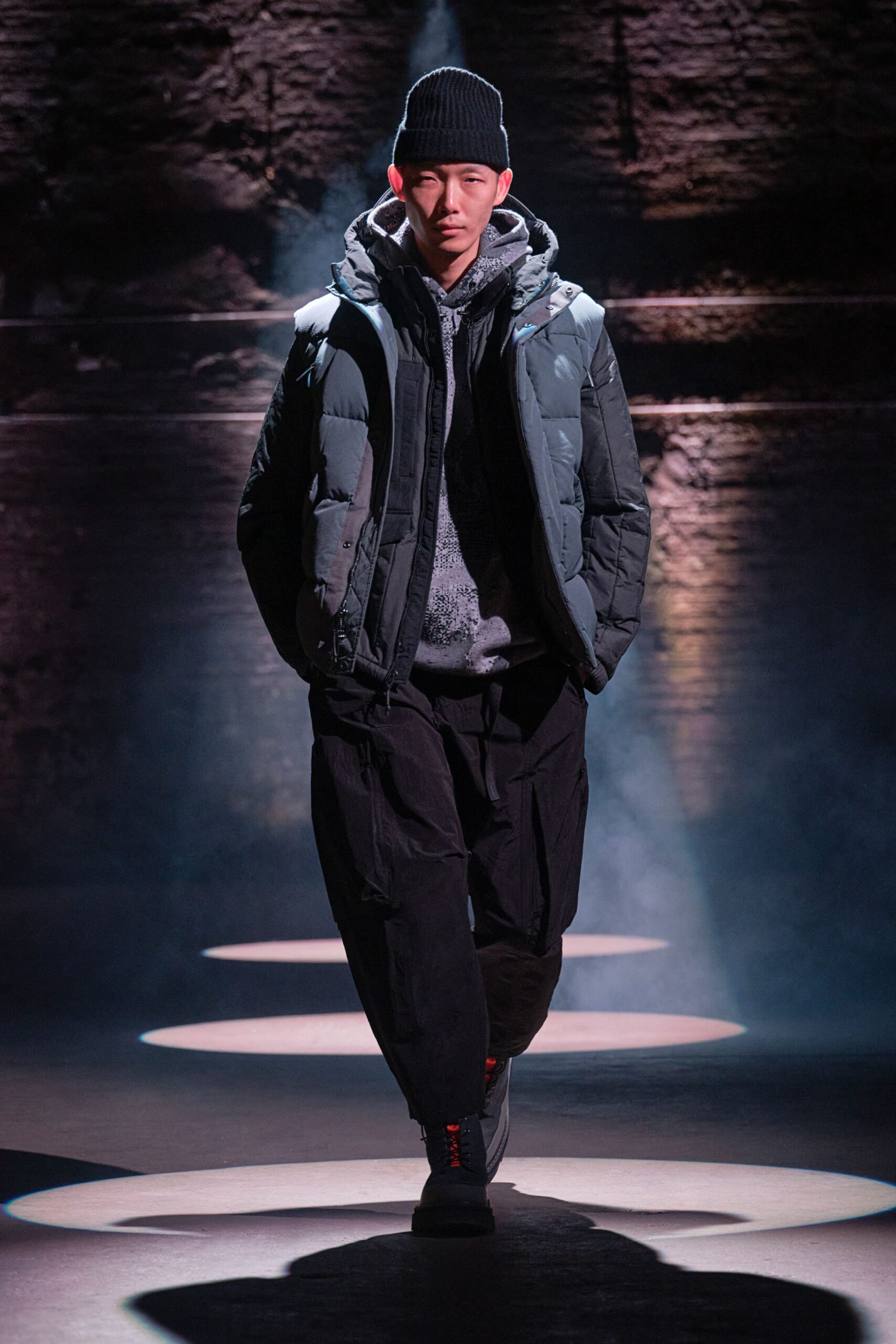 black padded jacket gray sweater