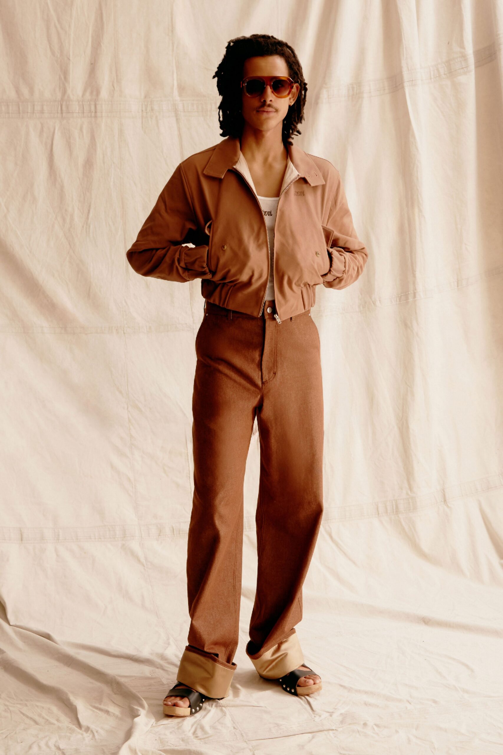 beige jacket brown pants