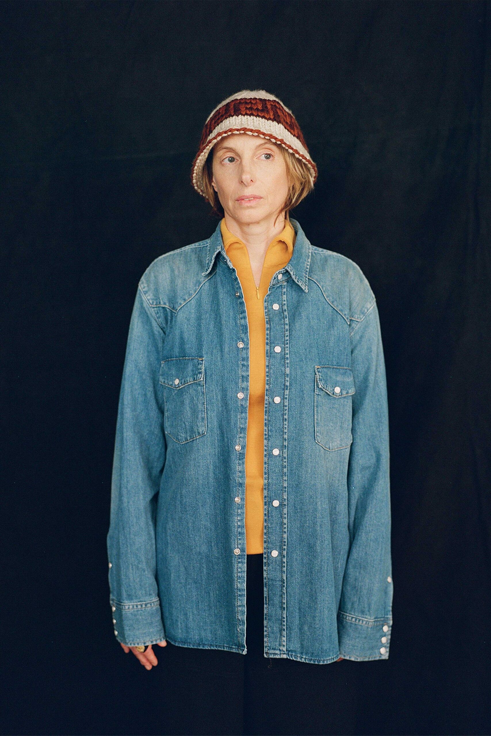 denim shirt and yellow top with hat