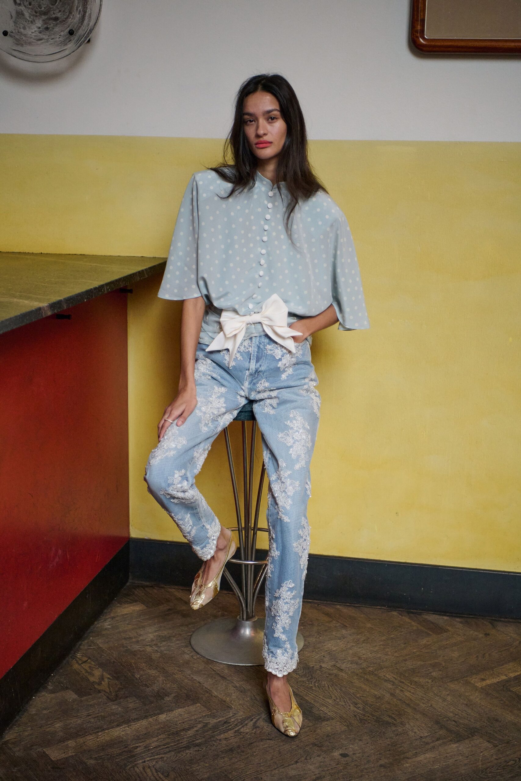 blue polka-dot top with distressed jeans