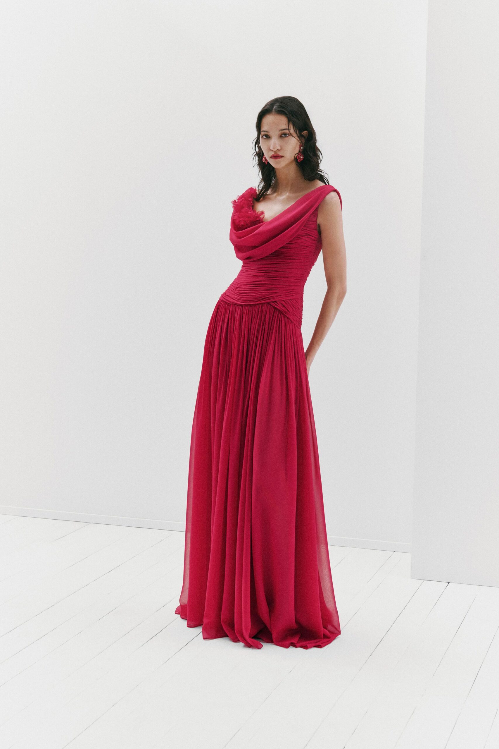 red flowing sleeveless gown