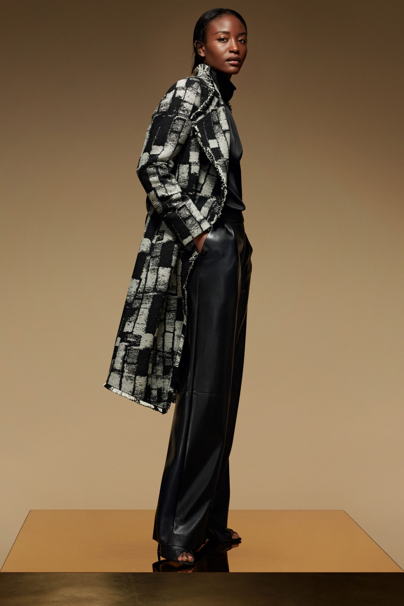 black wool long-sleeve collared relaxed printed coat